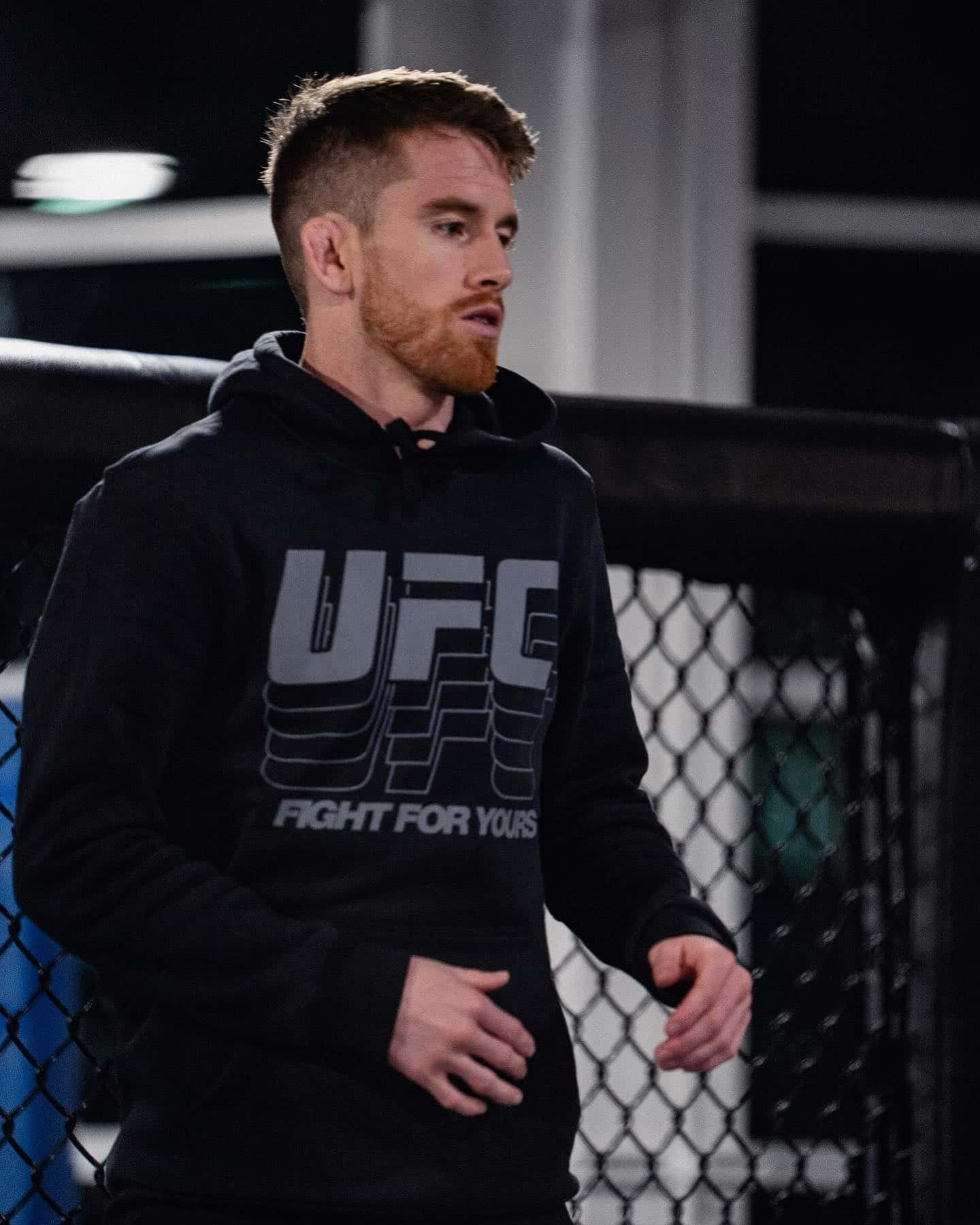Cory Sandhagen, UFC hoodie, dimly lit octagon cage, HD Phone Wallpaper