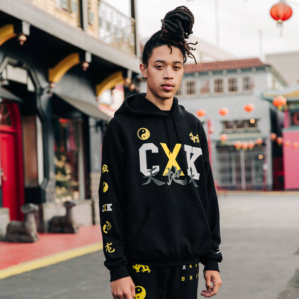 Coryxkenshin, black hoodie, bold yellow and white graphics, SD Desktop Wallpaper