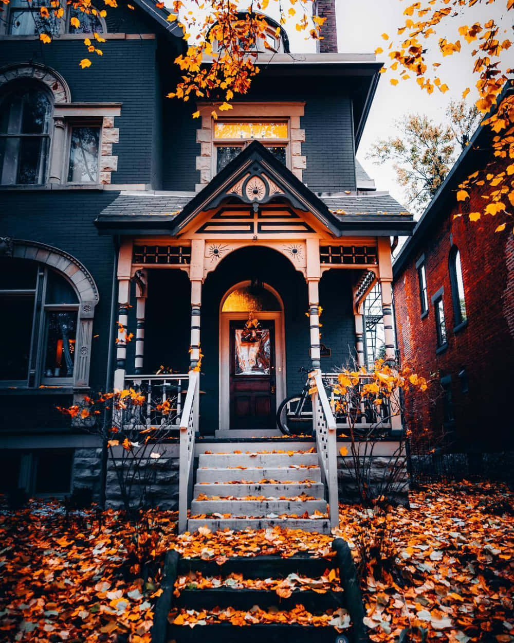 Victorian house, ornate porch steps, golden autumn leaves, SD Phone Wallpaper