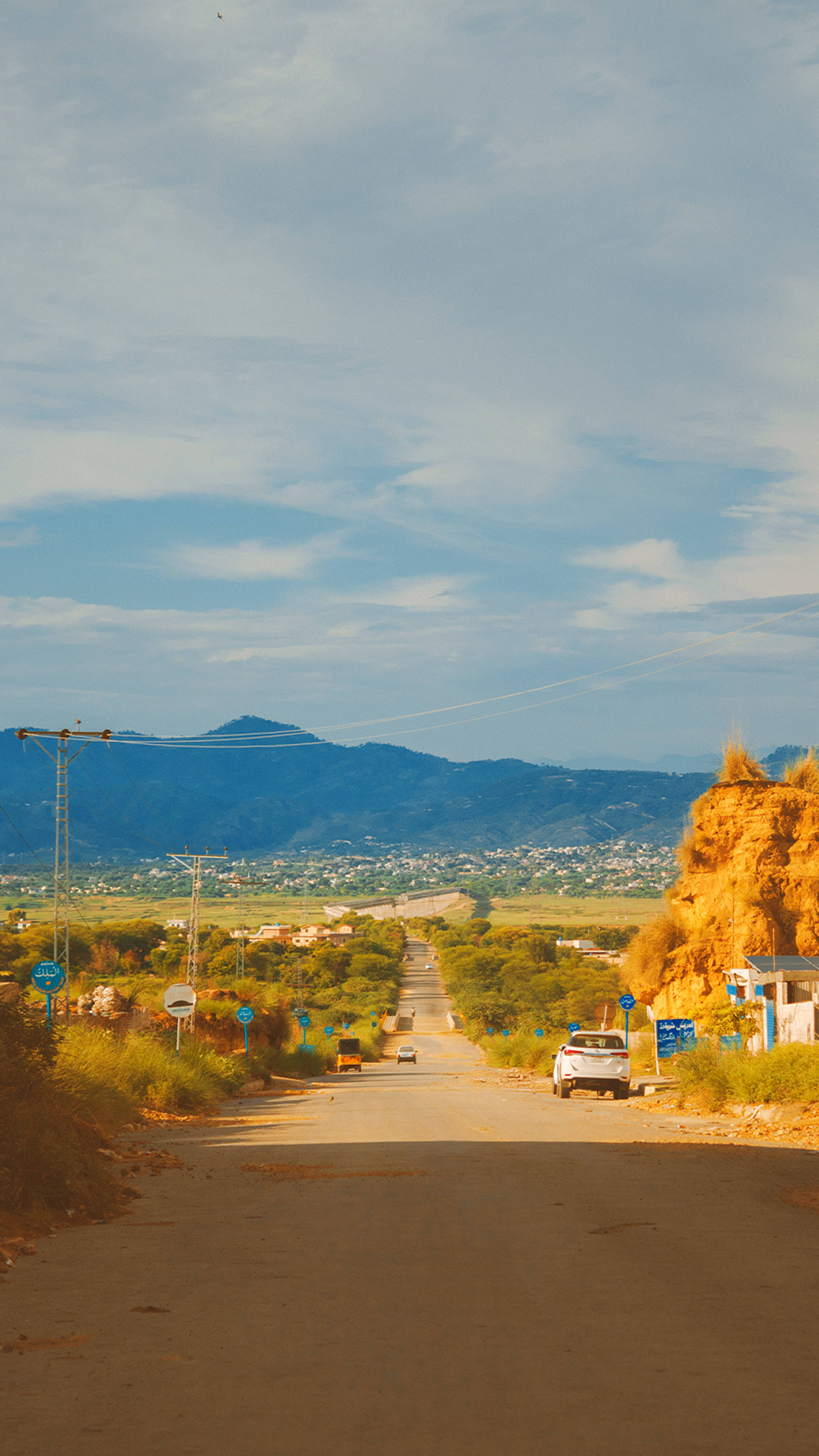 Cottagecore Aesthetic Road, winding rural road, distant mountains, 4K Phone Wallpaper