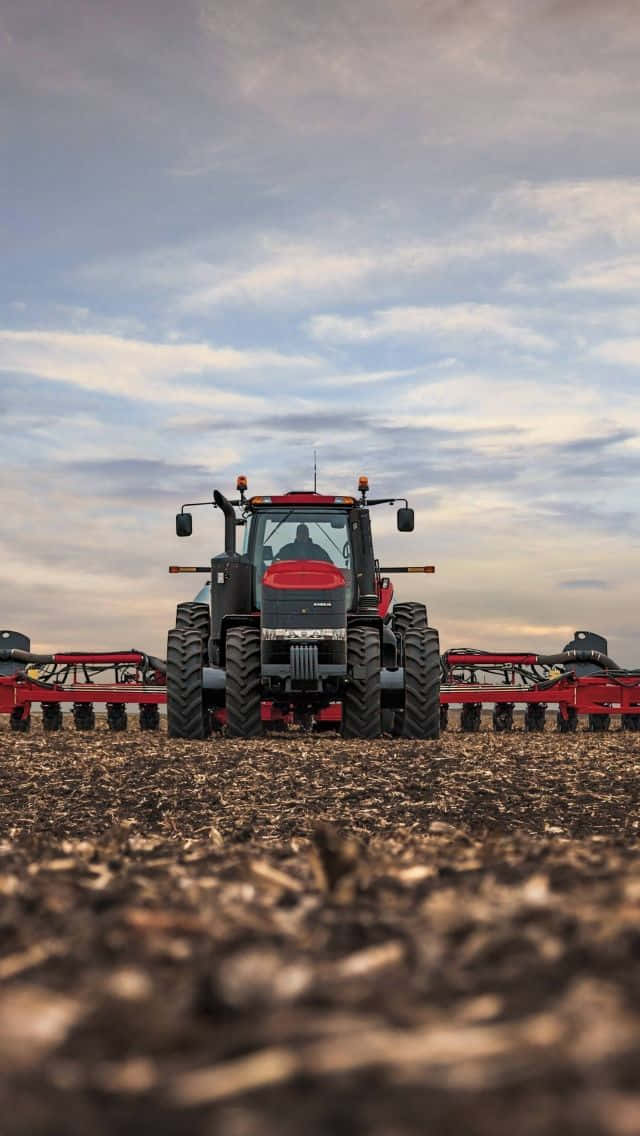 red tractor, black tractor, large tires, SD Phone Wallpaper