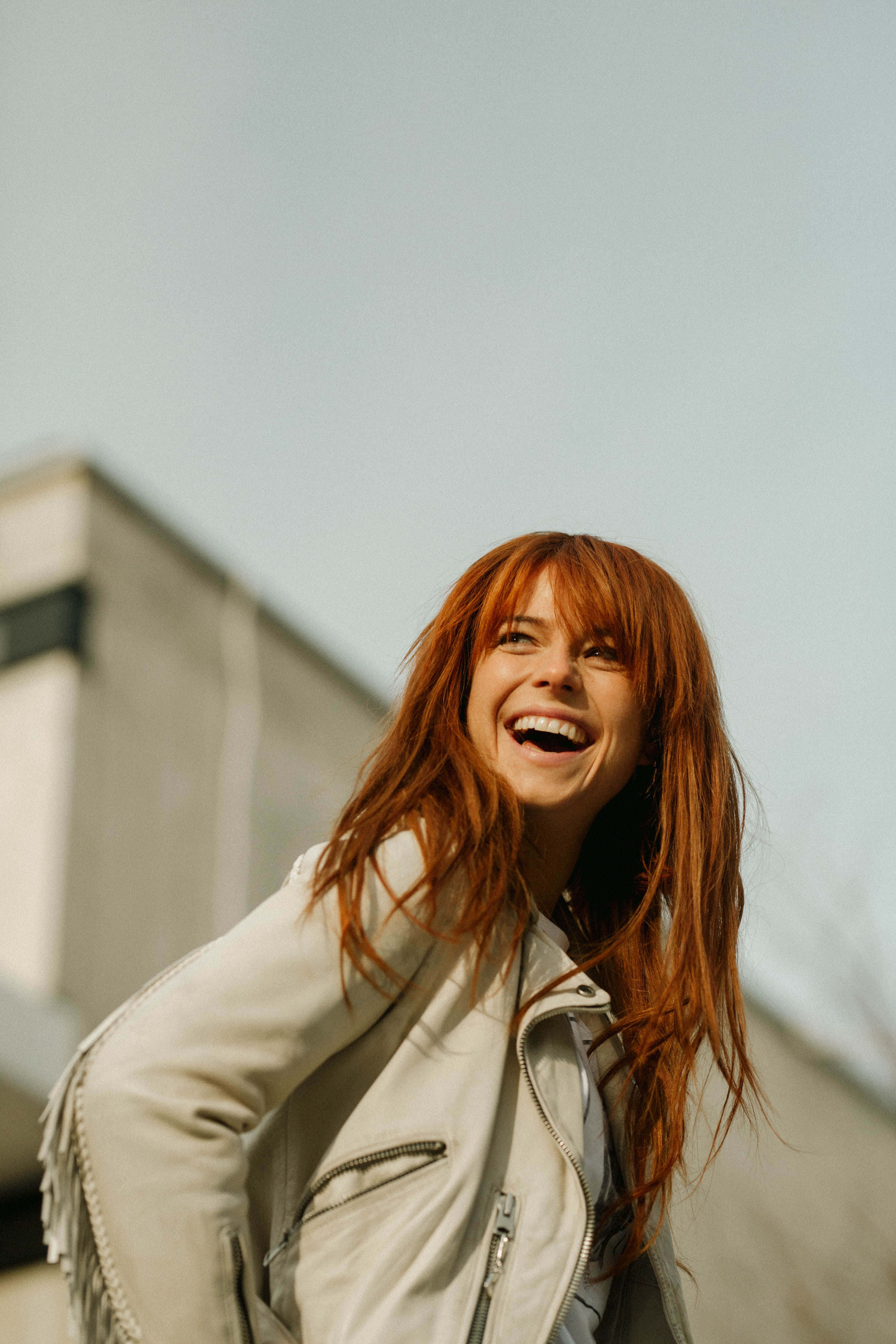 red hair, fringed white jacket, soft daylight, 5K Phone Wallpaper