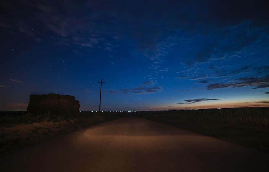 dirt road, starry twilight sky, city lights, SD Desktop Wallpaper
