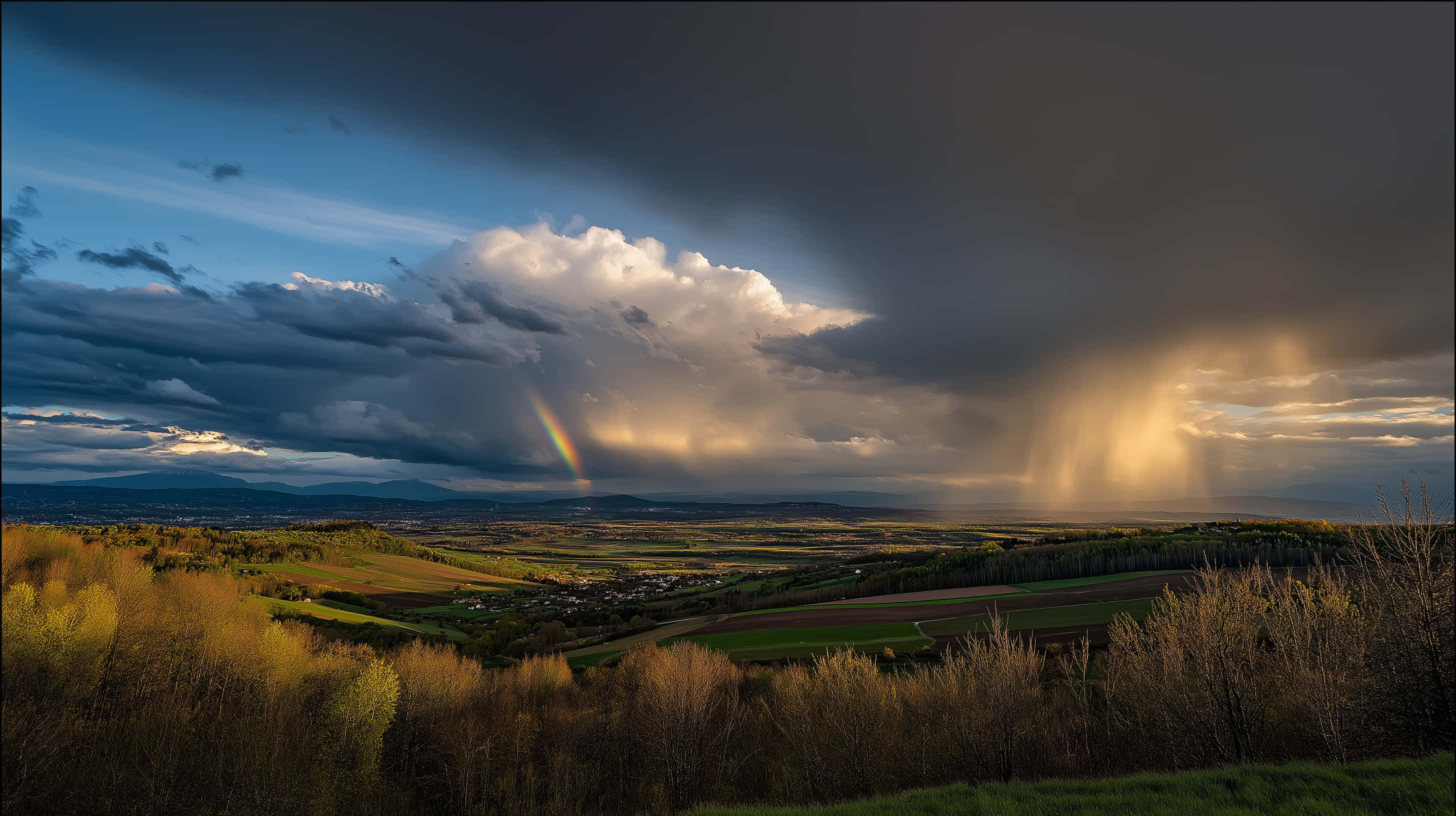 dramatic stormy sky, rainbow, green landscape, 2K Desktop Wallpaper