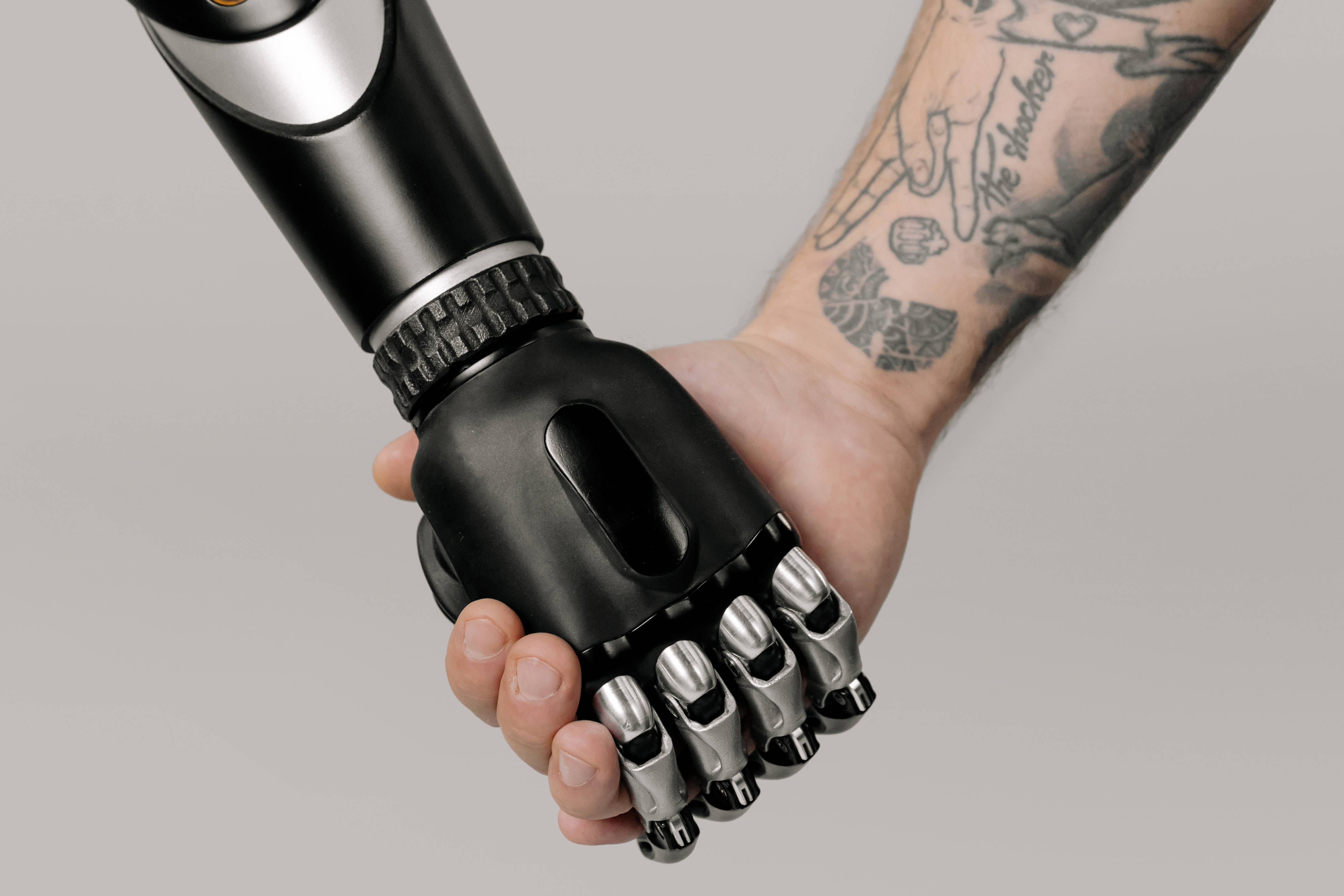 robot couple hands, sleek black robotic hand, human hand with tattoos, 4K Desktop Wallpaper