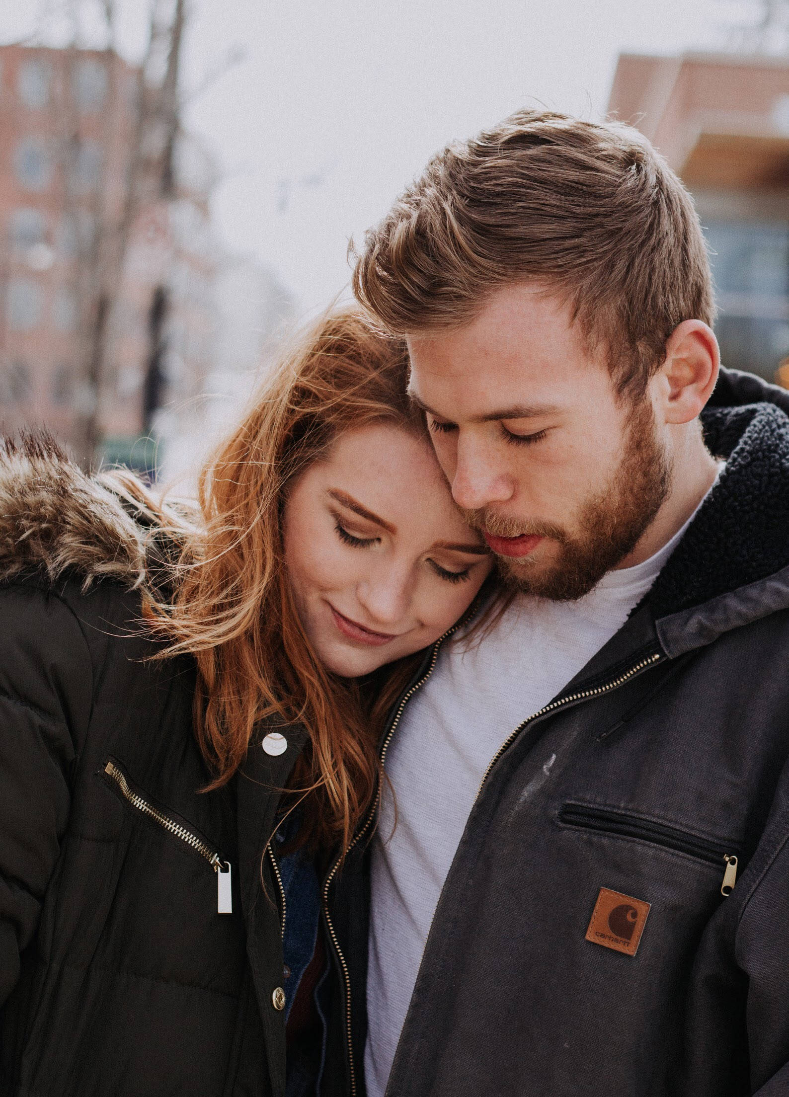 winter coats, urban backdrop, tender moment, Full HD Phone Wallpaper