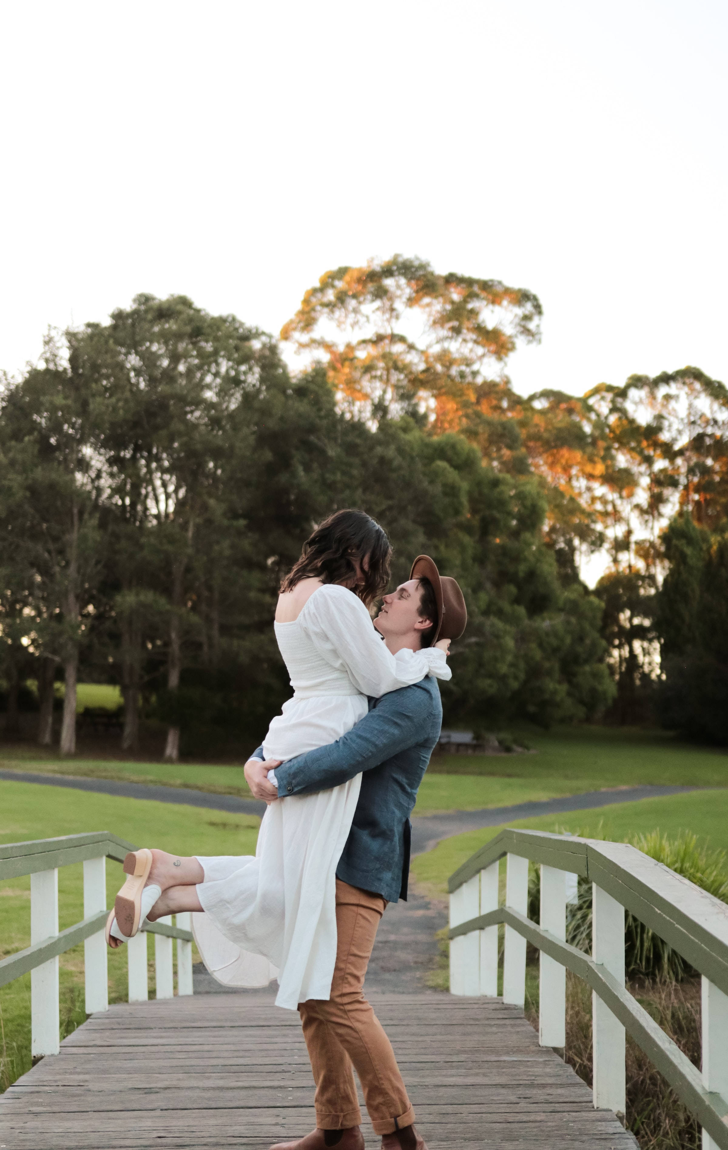 couple hugging, catcher hug, wooden bridge, 2K Phone Wallpaper