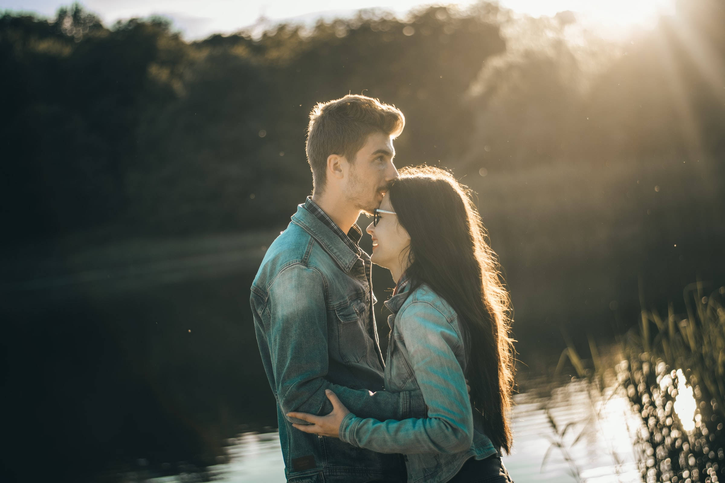 couple hugging, kiss on forehead, sunlit lake, Full HD Desktop Wallpaper