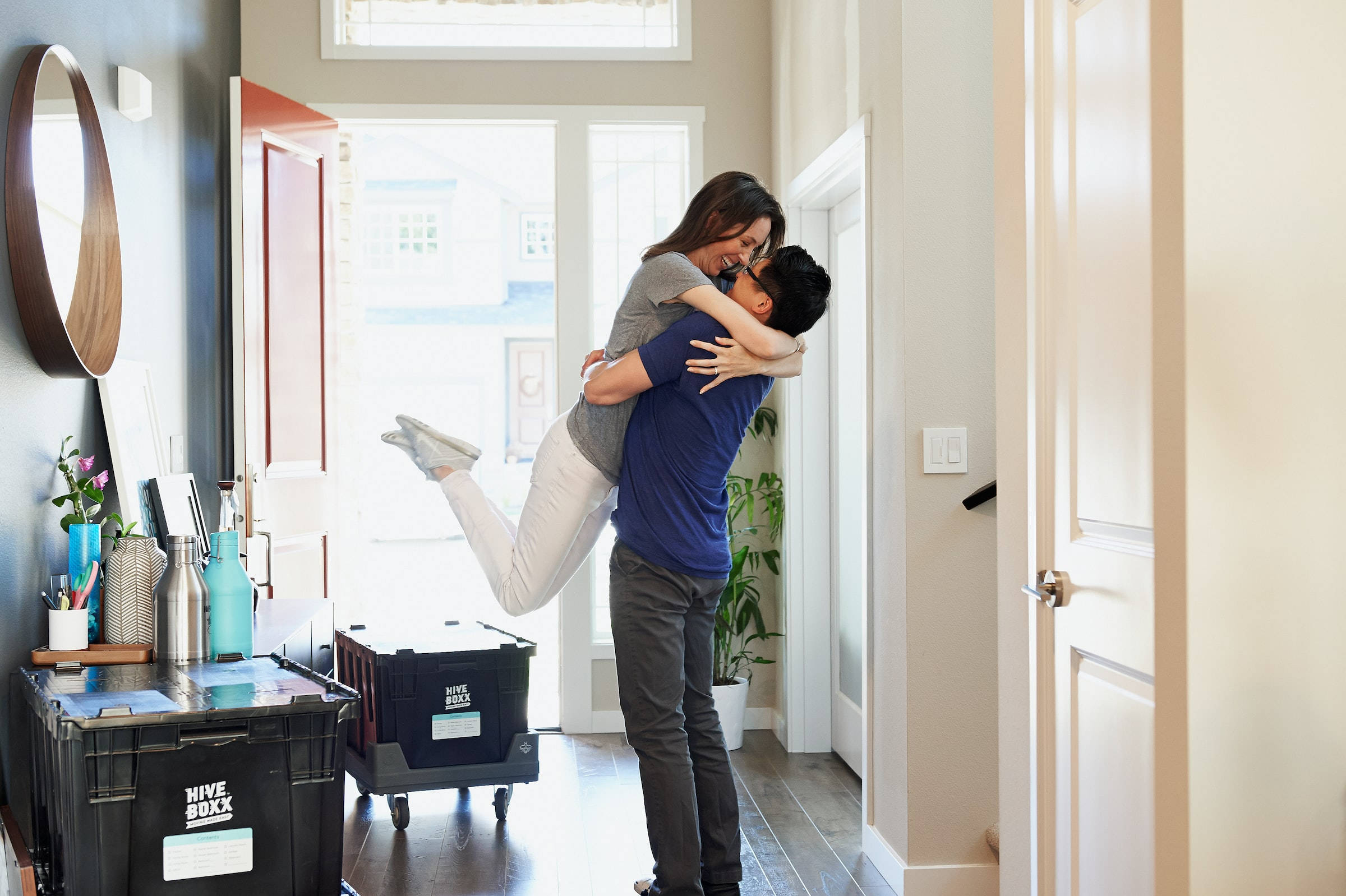 couple hugging, catcher hug position, sunlit hallway, Full HD Desktop Wallpaper