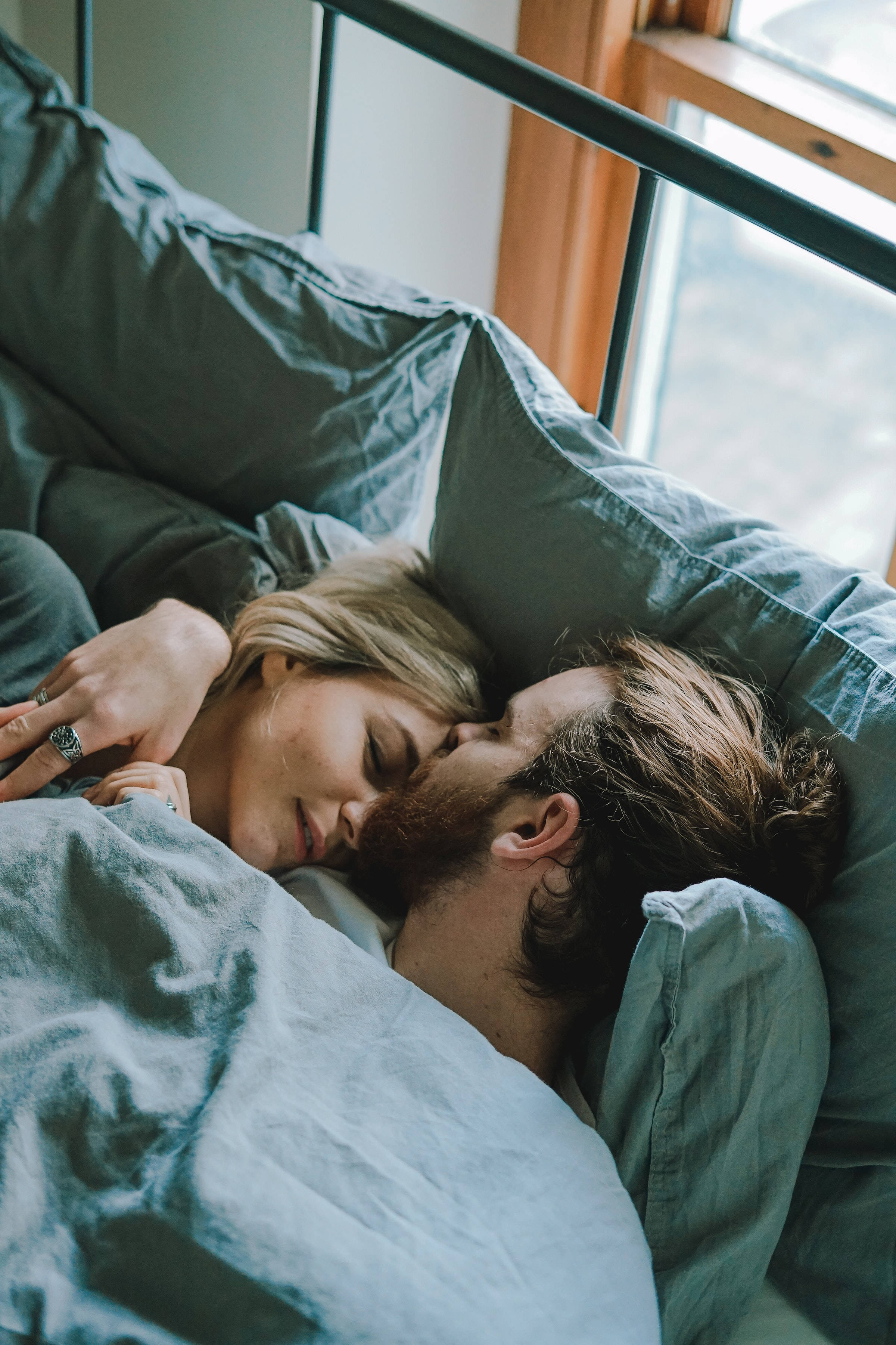 couple hugging, kiss on the forehead, bed, 2K Phone Wallpaper