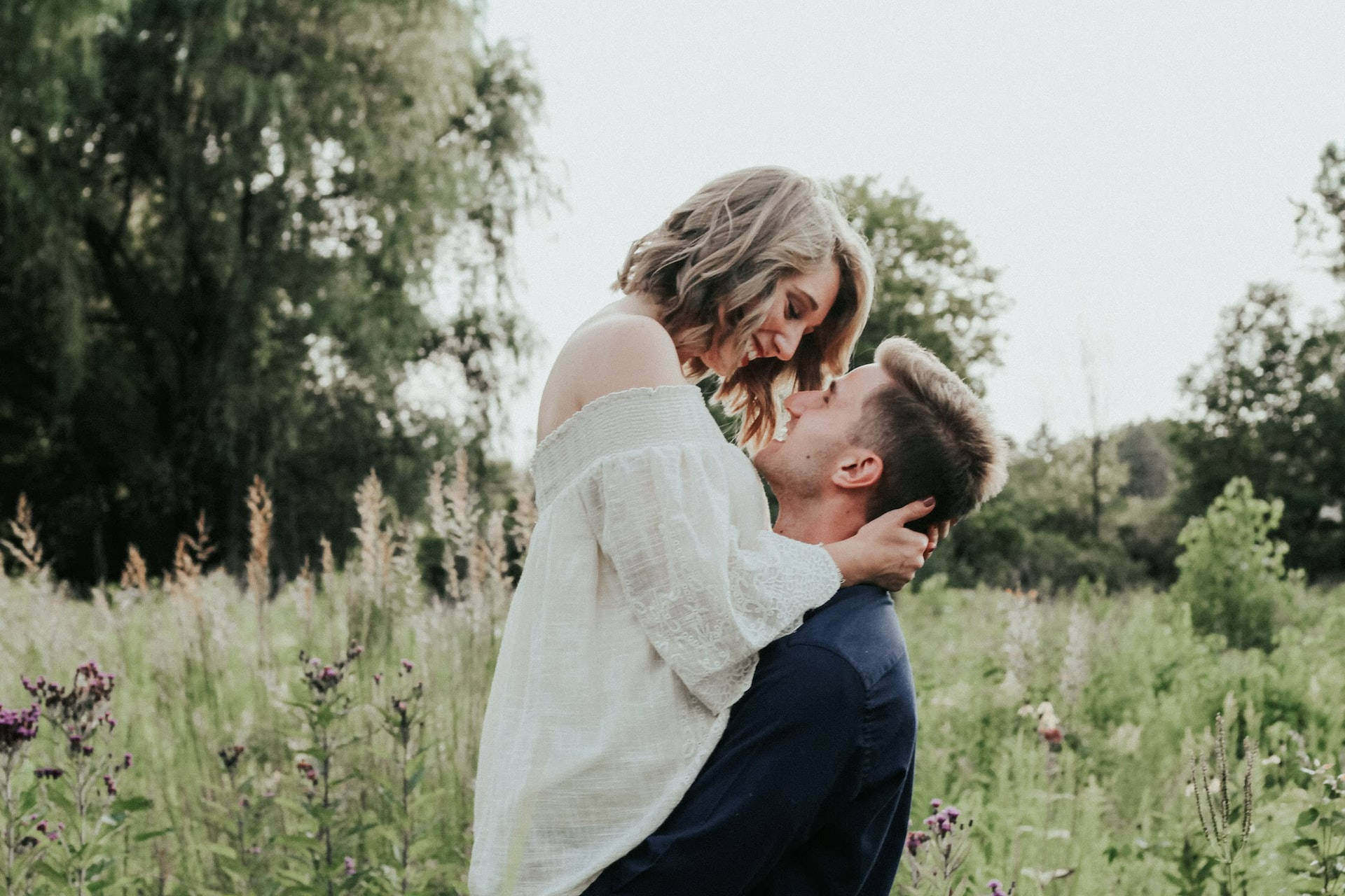 couple hugging, catcher hug position, outdoor field, Full HD Desktop Wallpaper
