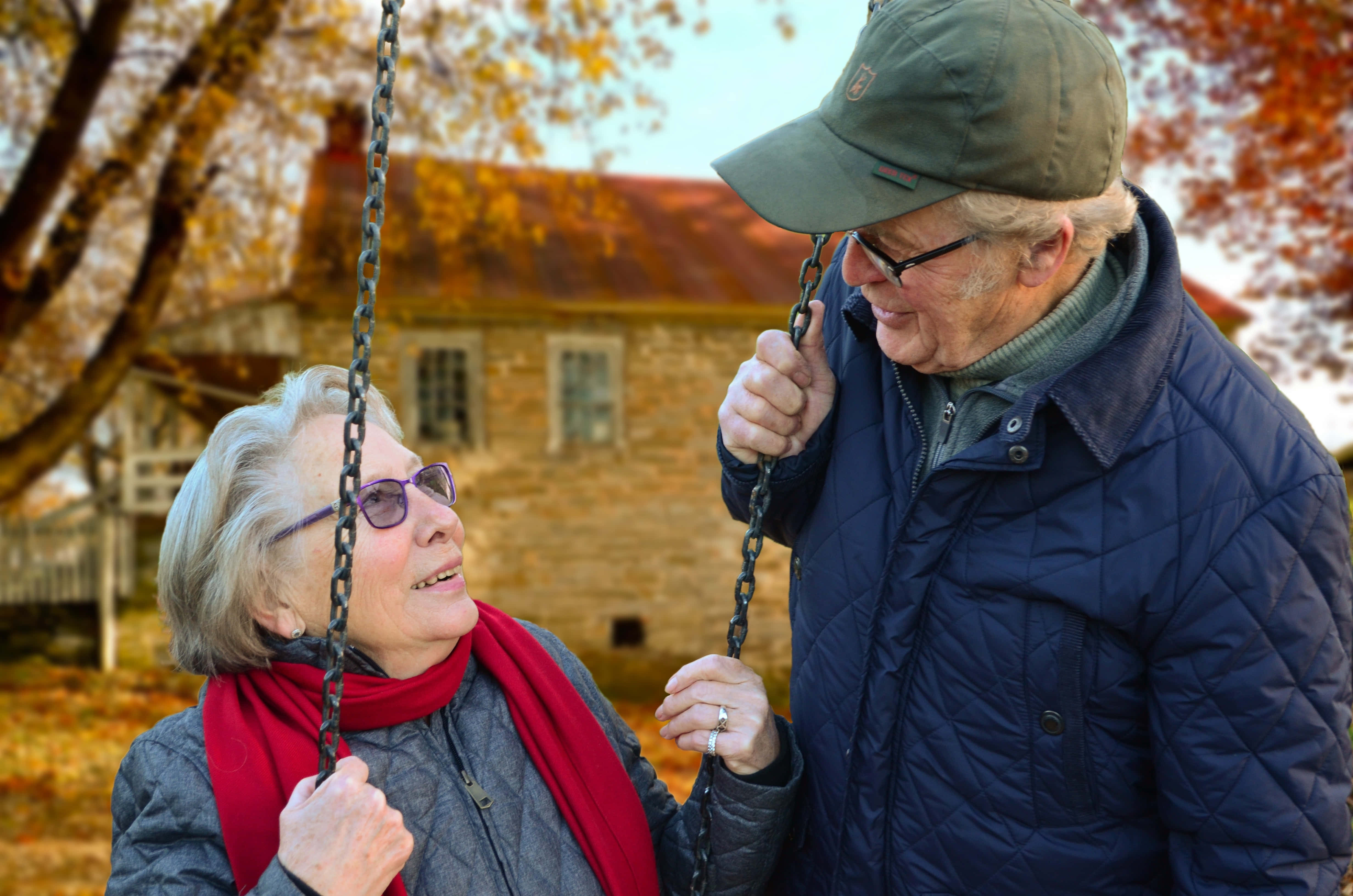 old couple, swing chair, autumn trees, 4K Desktop Wallpaper