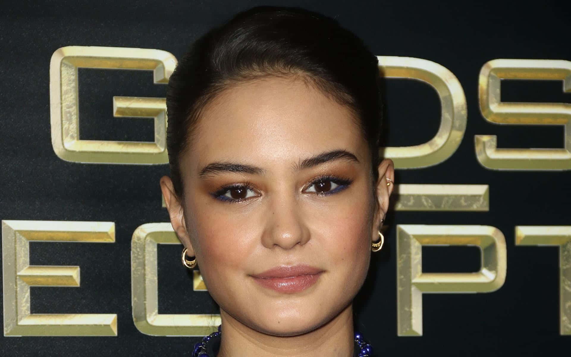 Courtney Eaton, golden 'GODS OF EGYPT' lettering, black backdrop, Full HD Desktop Wallpaper