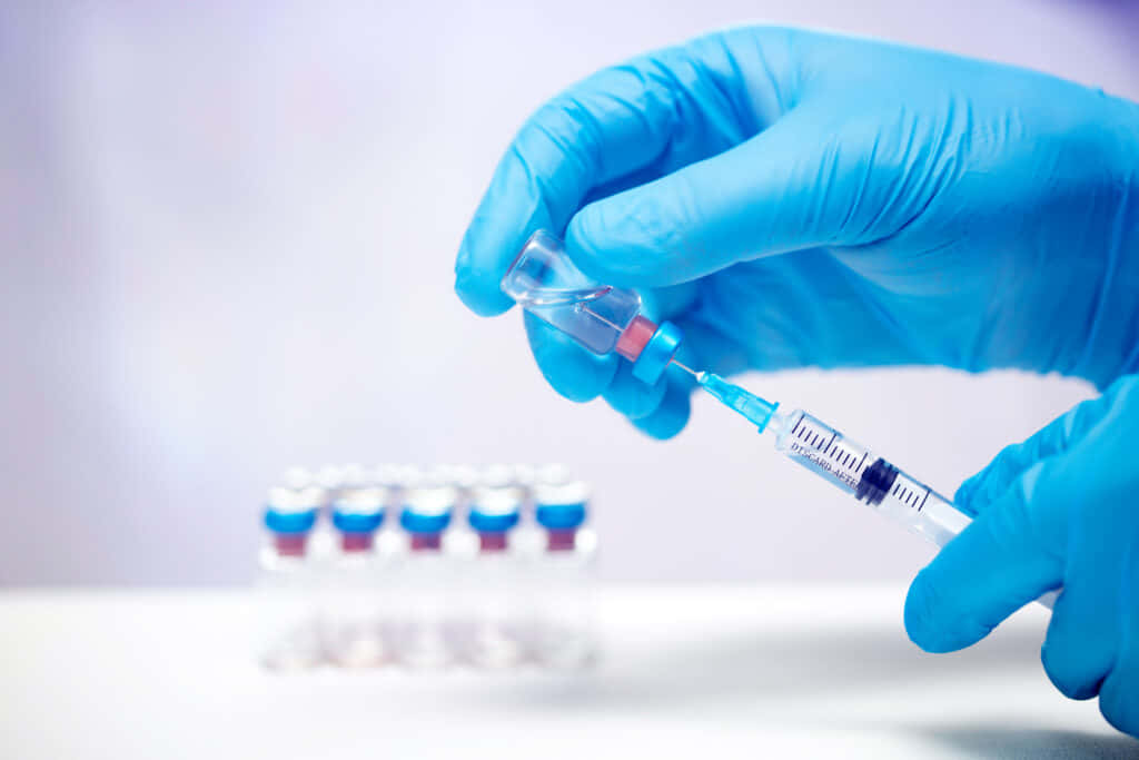 COVID-19 Vaccine Clinical Trials, gloved hand, vial, SD Desktop Wallpaper