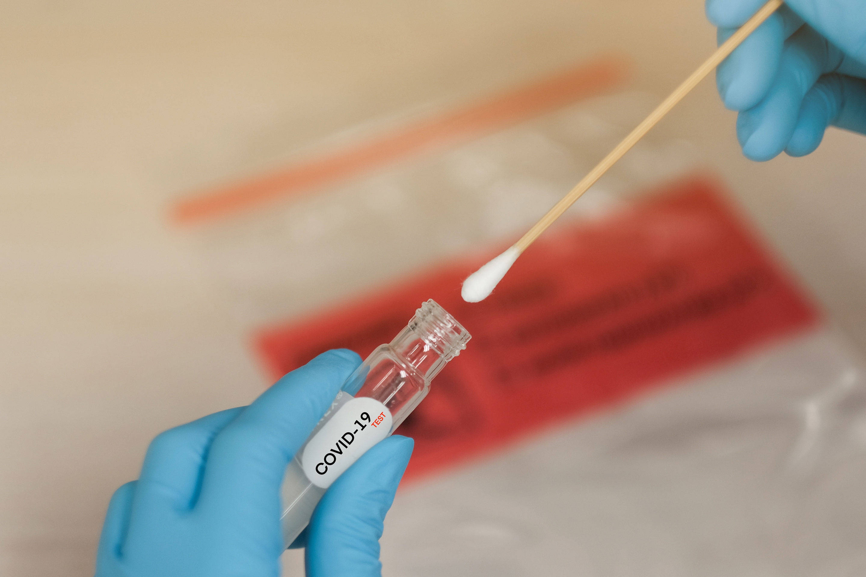 COVID-19 test vial, cotton swab, gloved hands, 2K Desktop Wallpaper