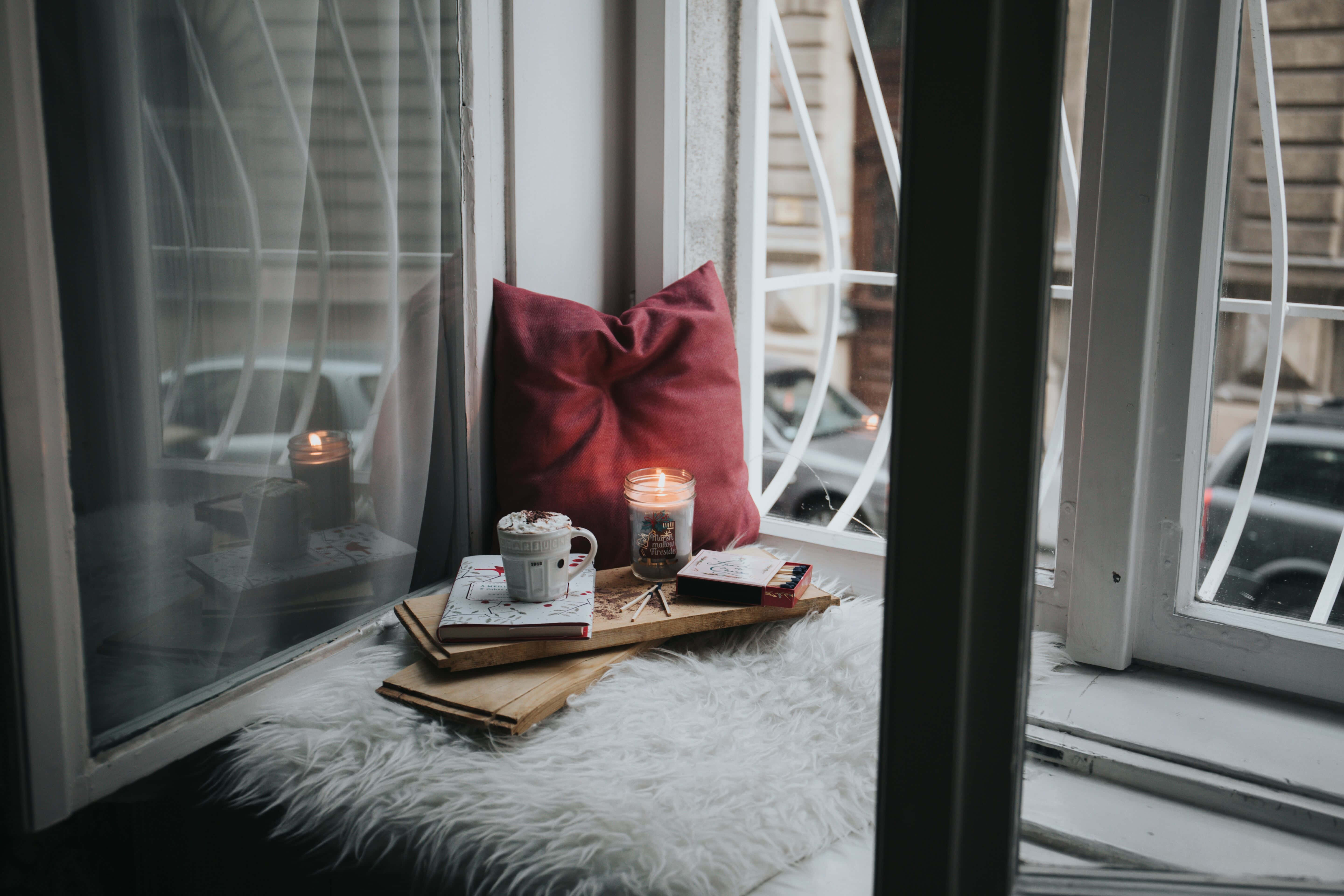 cozy window nook, white furry rug, red pillow, 5K Desktop Wallpaper