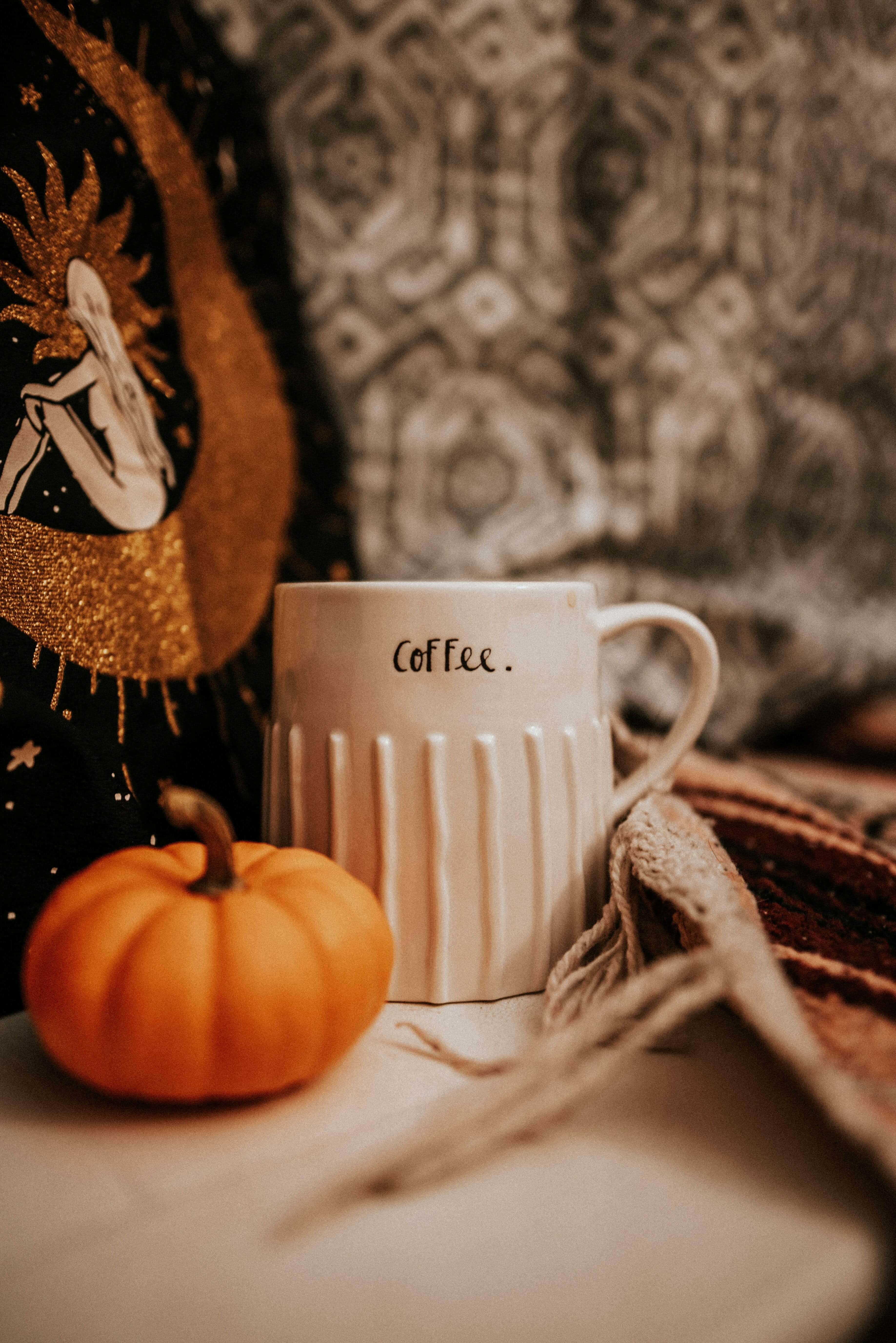white ribbed coffee mug, small orange pumpkin, textured surface, 5K Phone Wallpaper