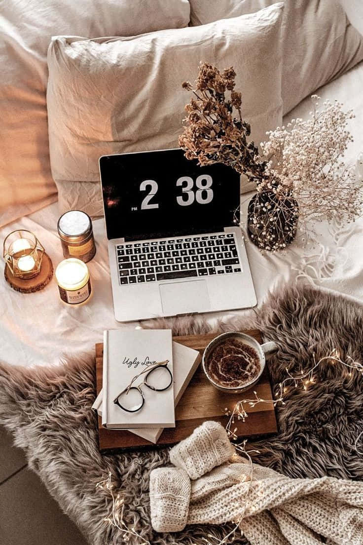 cozy workfrom home setup, laptop, 2 38 pm candles, SD Phone Wallpaper