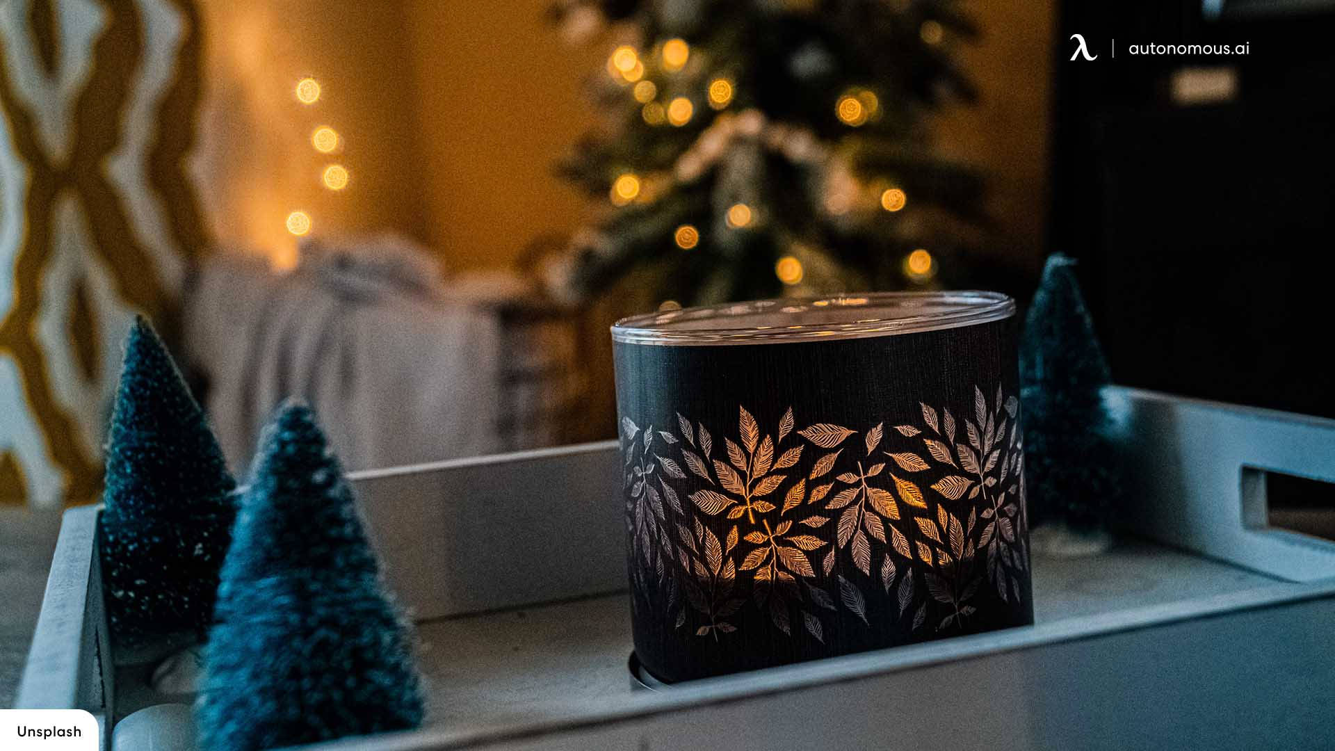 cozy christmas aesthetic candle, black leaf-patterned holder, miniature blue trees, Full HD Desktop Wallpaper
