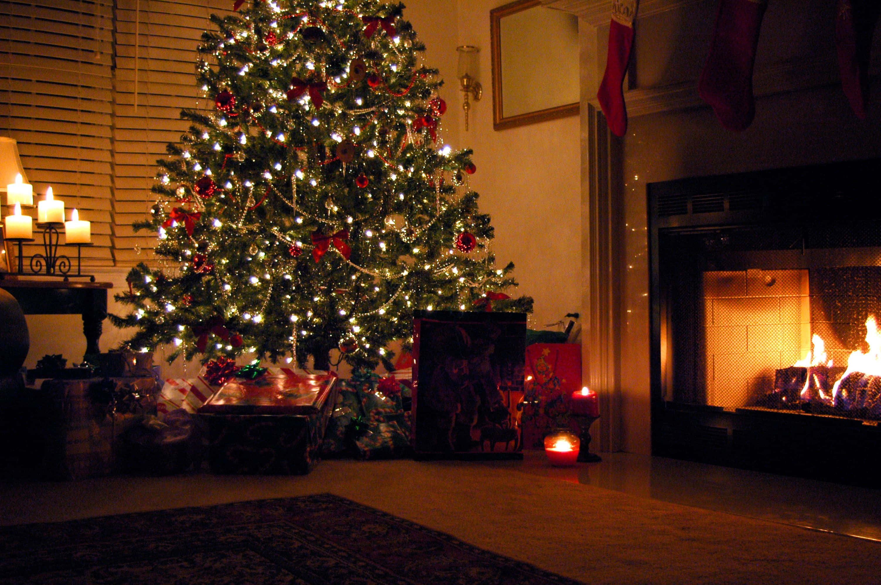 Cozy Christmas Fireplace, Christmas tree, red ornaments, 2K Desktop Wallpaper
