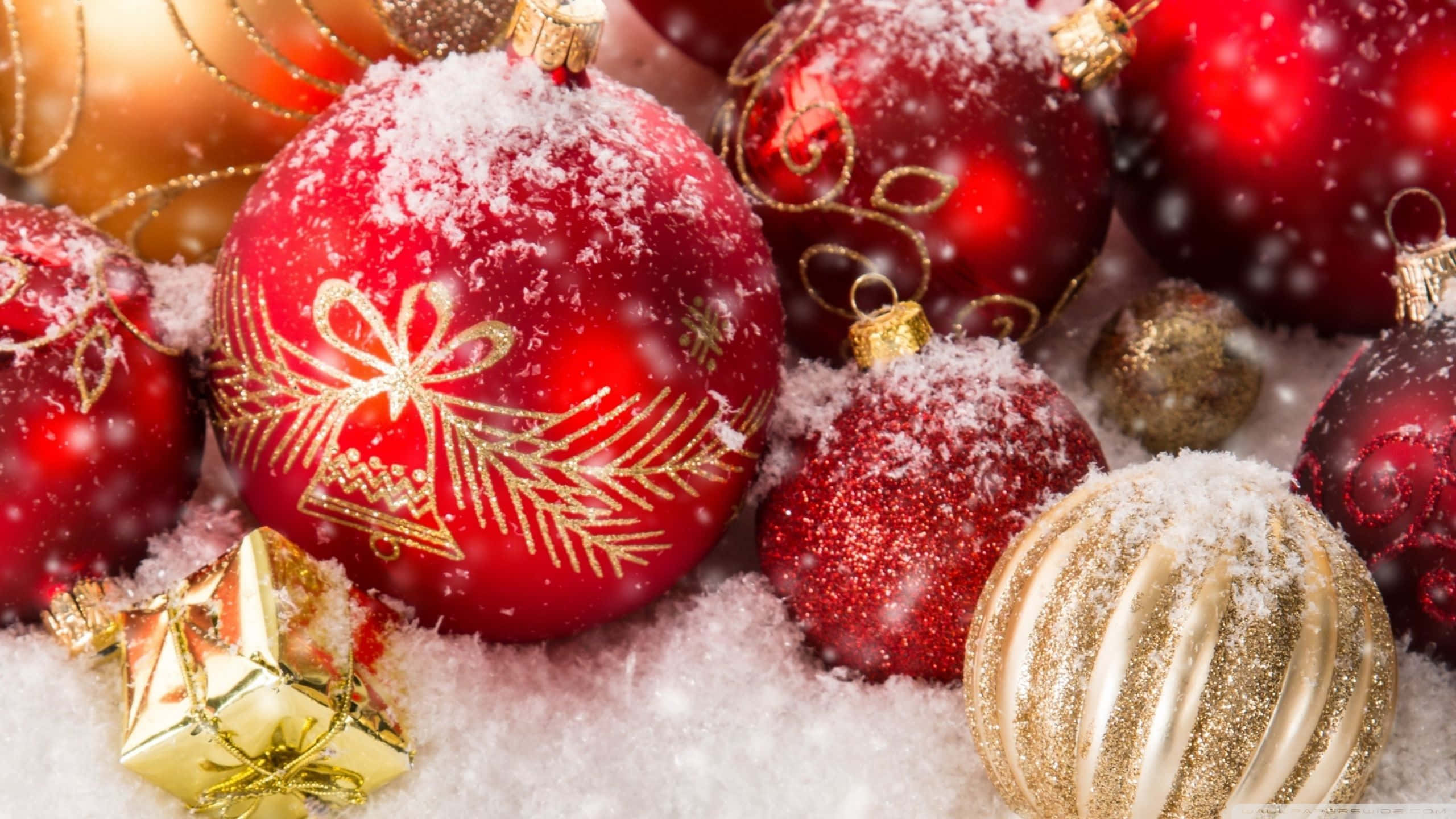 Cozy Christmas, shiny red and gold Christmas ornaments, snowy surface, 2K Desktop Wallpaper