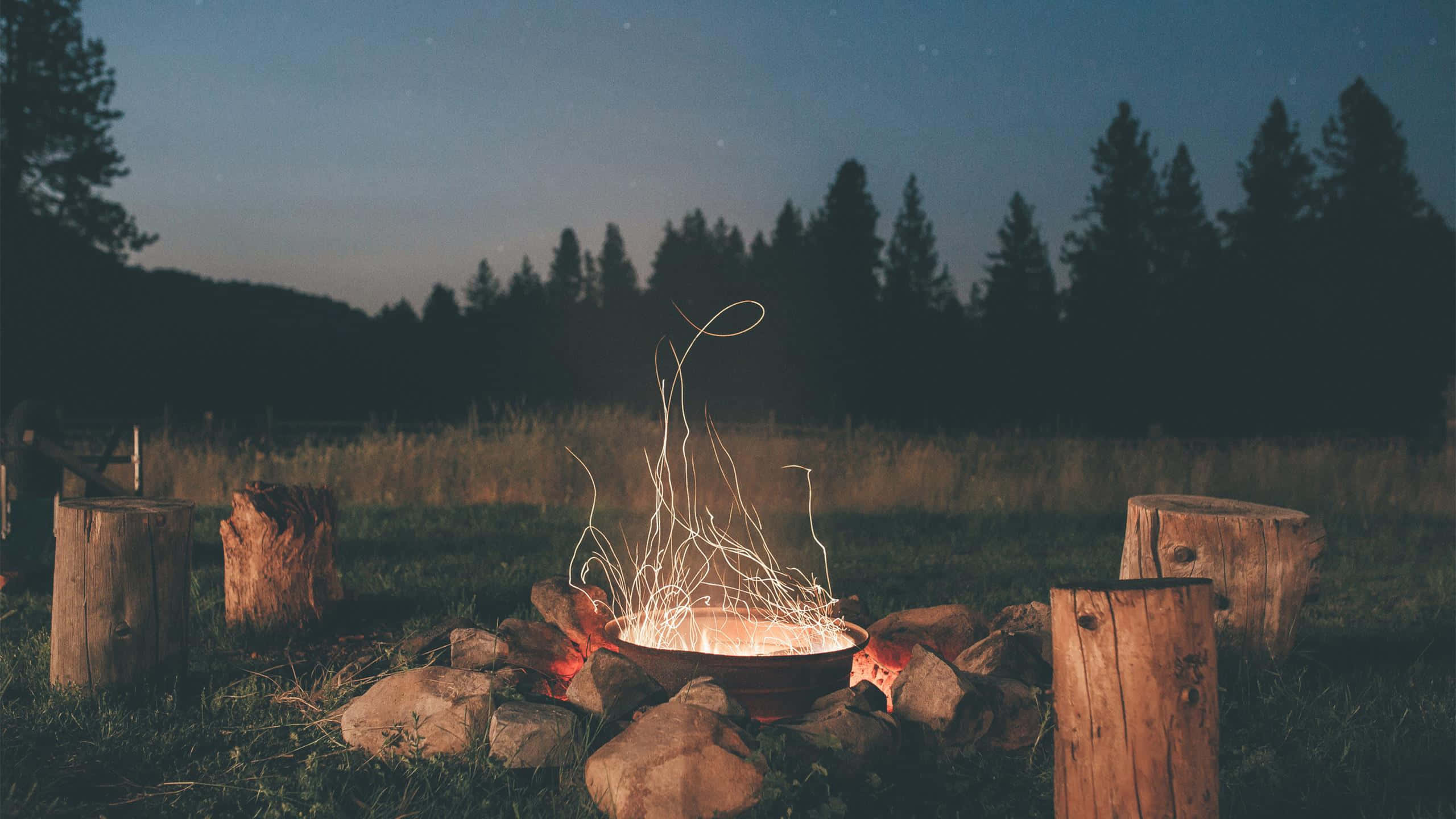 cozy fire, glowing campfire, dancing sparks, 2K Desktop Wallpaper