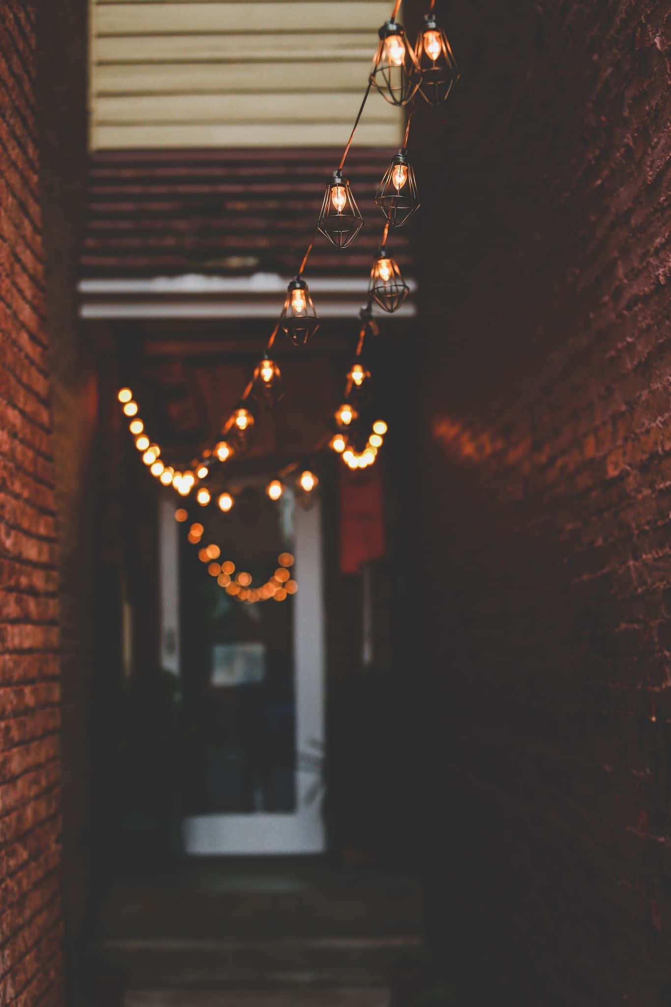 string lights, brick walls, narrow alleyway, Full HD Phone Wallpaper