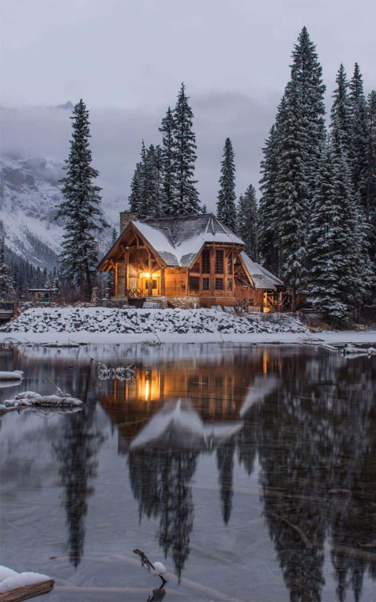 Cozy Winter House, snow-covered wooden cabin, frozen lake, SD Phone Wallpaper