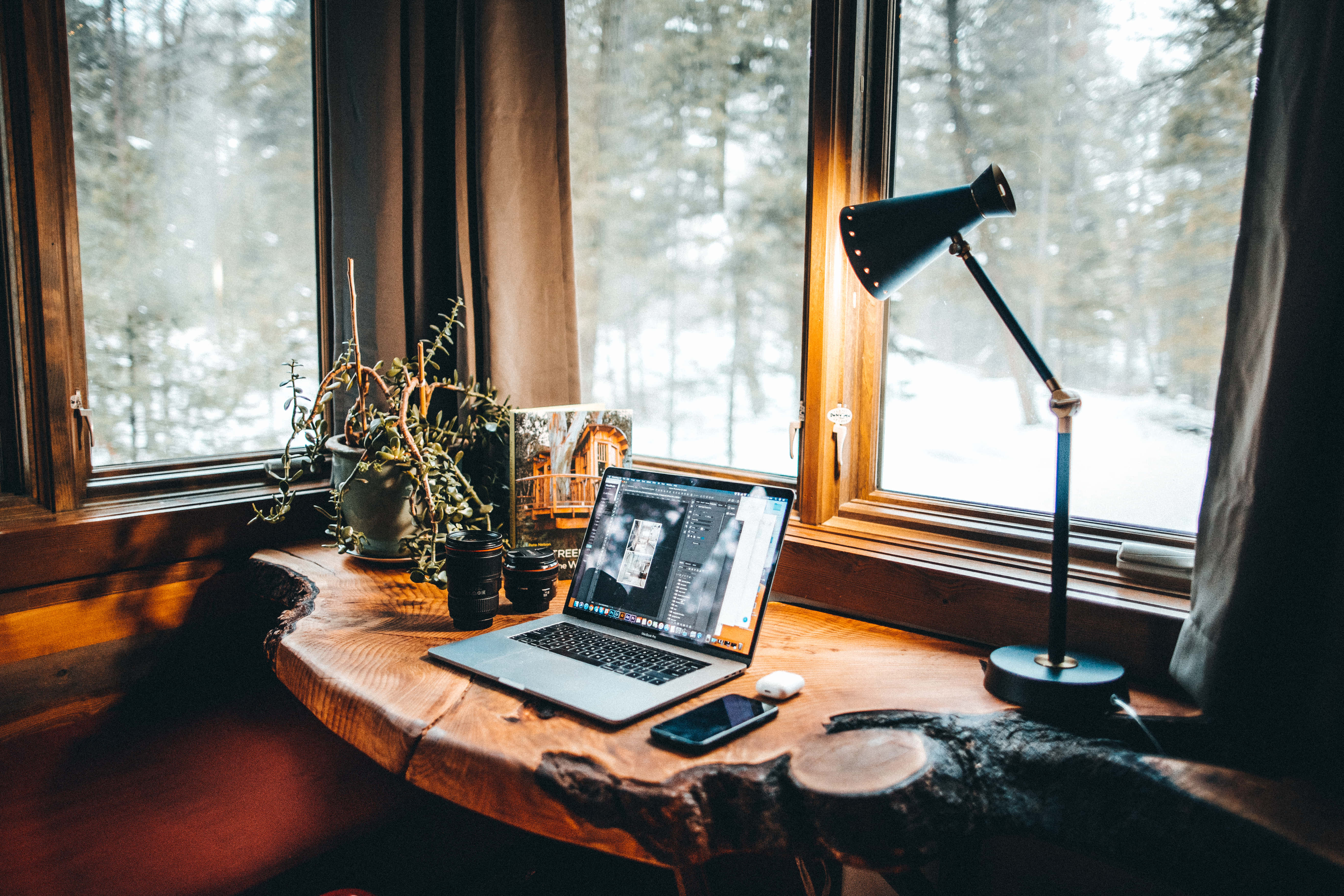cozy winter desktop, wooden desk, snowy window, 5K Desktop Wallpaper