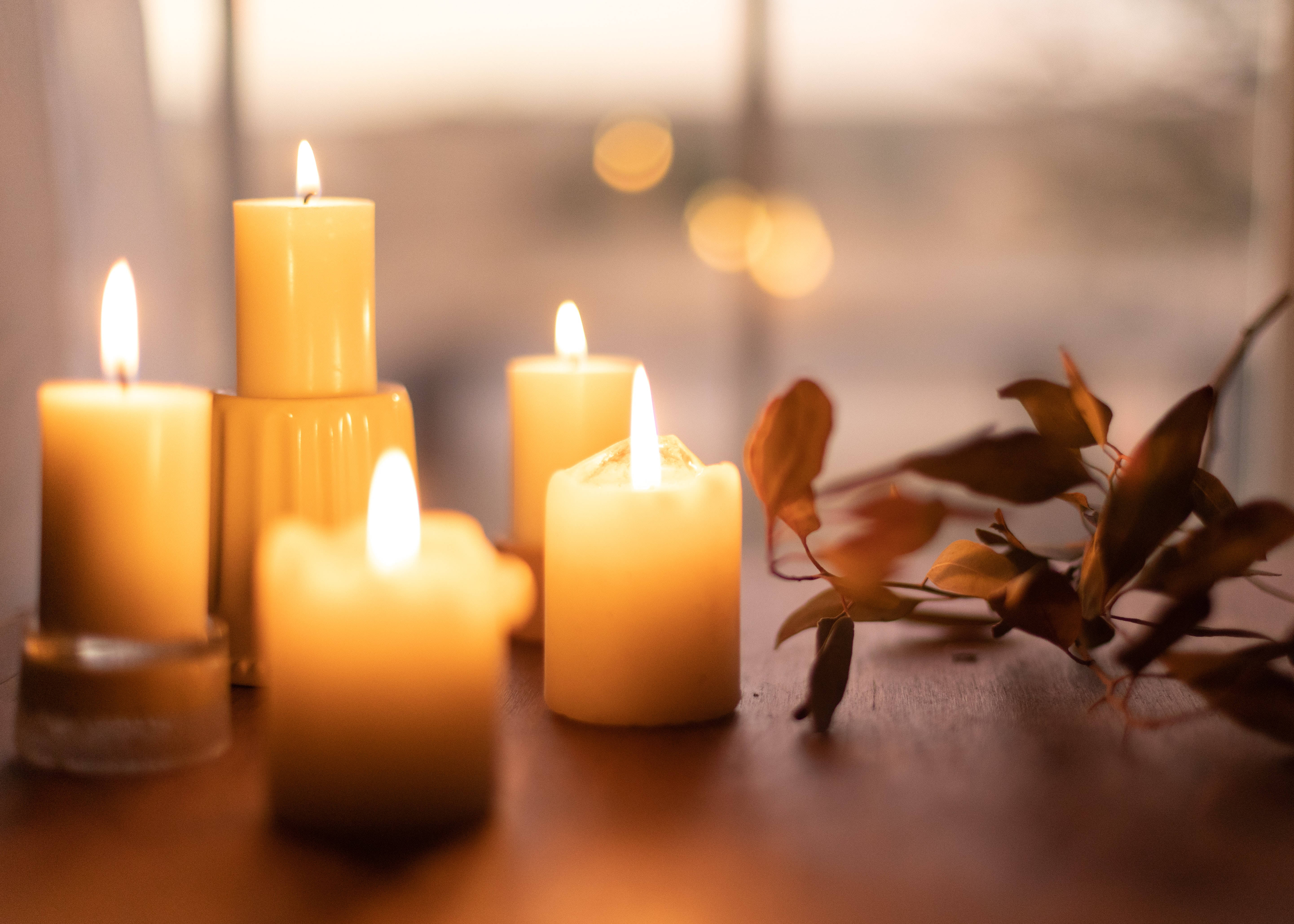 cozy autumn candles, warm glowing candles, autumn leaves, 5K Desktop Wallpaper