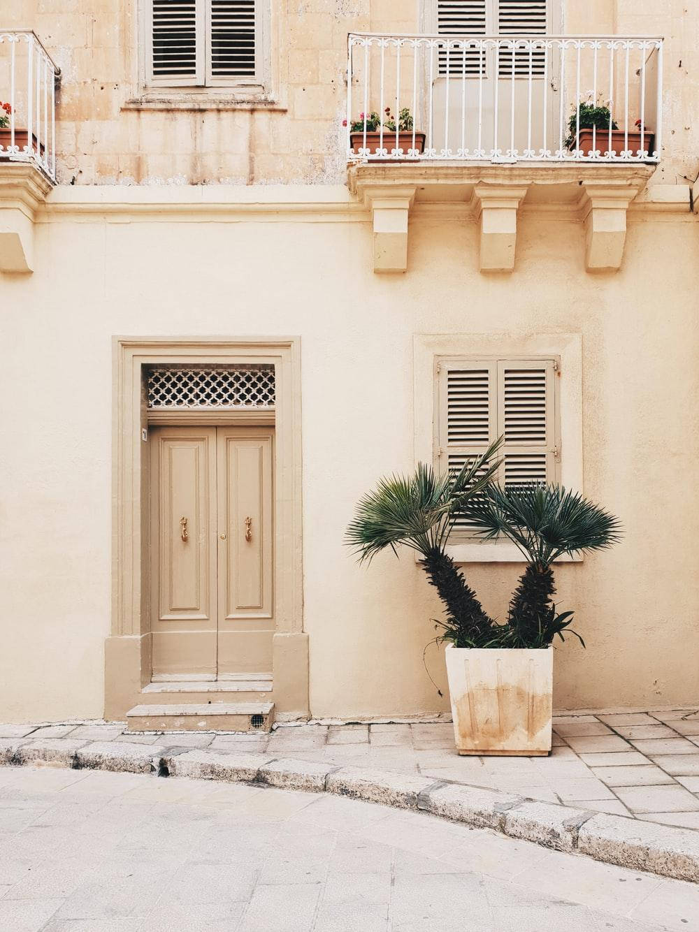 beige building facade, wooden door, white balconies, HD Phone Wallpaper