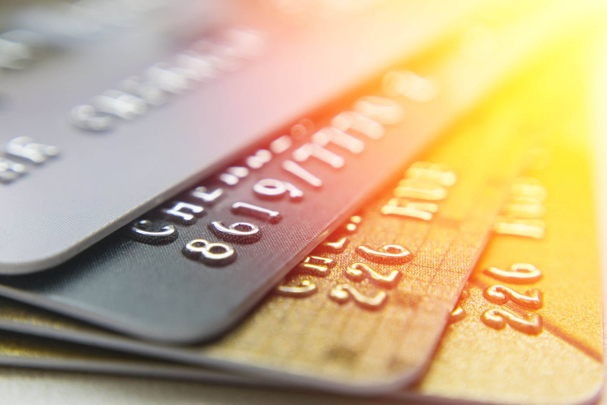 metallic colored credit cards, stack, warm lens flare, Full HD Desktop Wallpaper