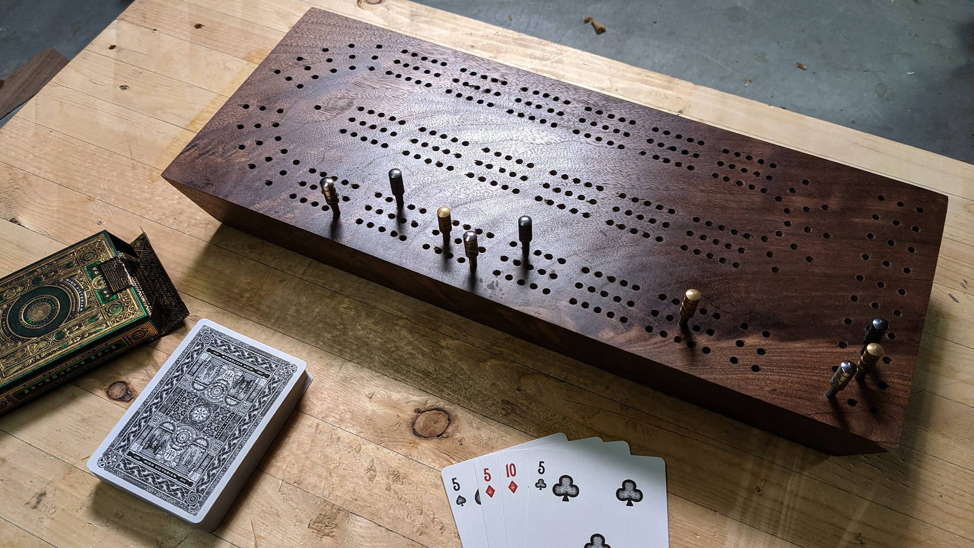 dark wood cribbage board, metal pegs, light wood table, Full HD Desktop Wallpaper