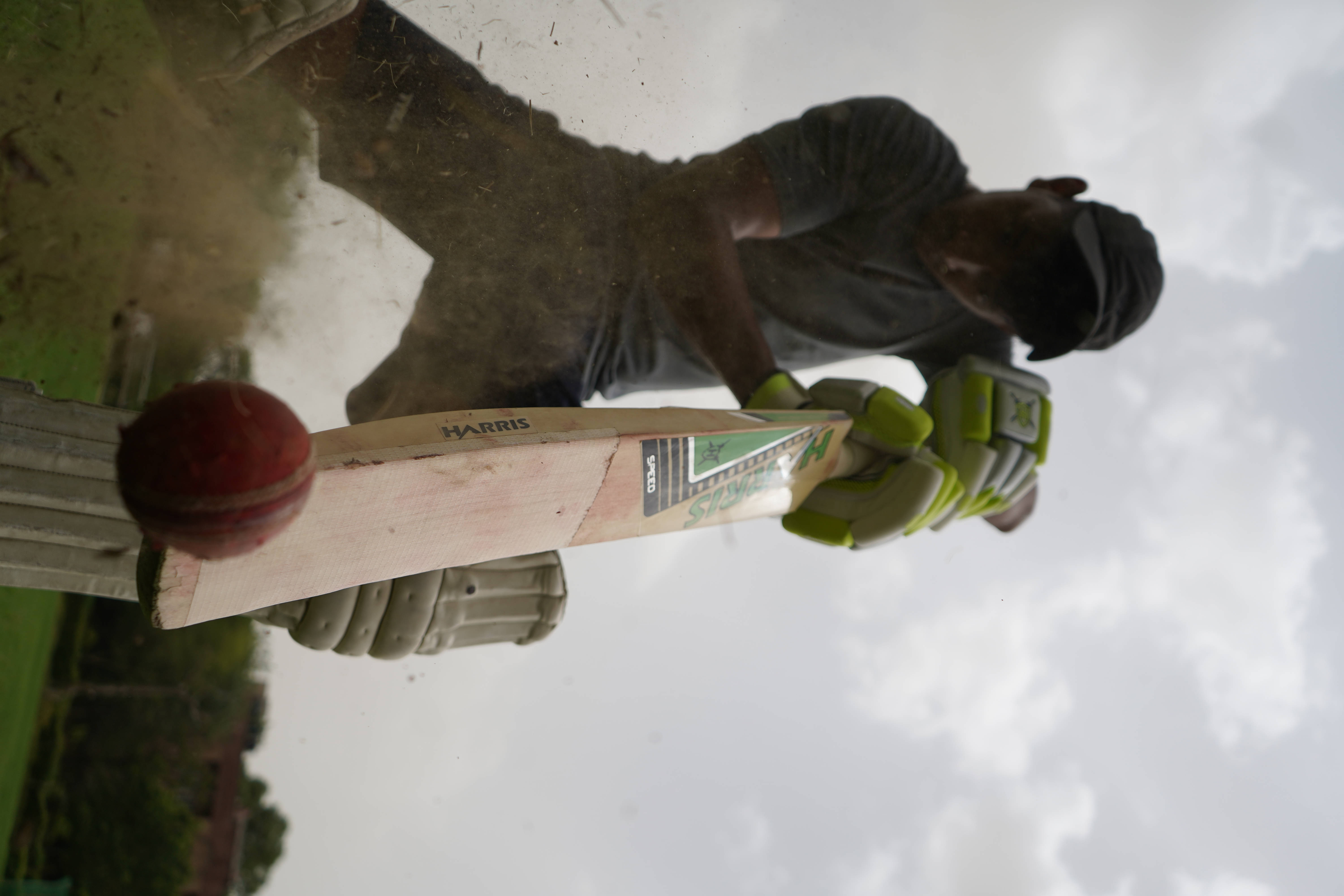 cricket player, green gloves, red ball, 5K Desktop Wallpaper