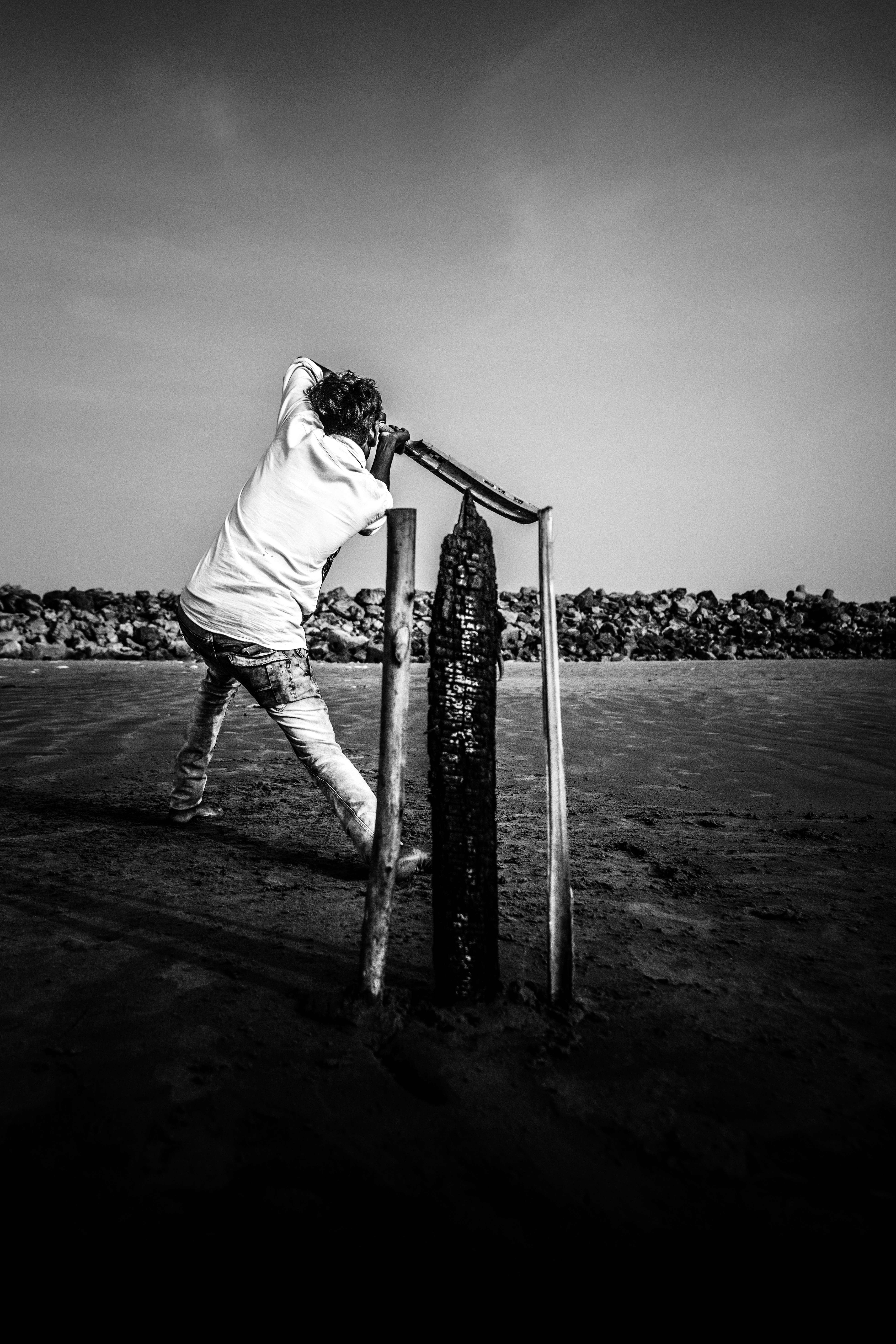 Cricket, black and white photograph, beach, 8K Phone Wallpaper