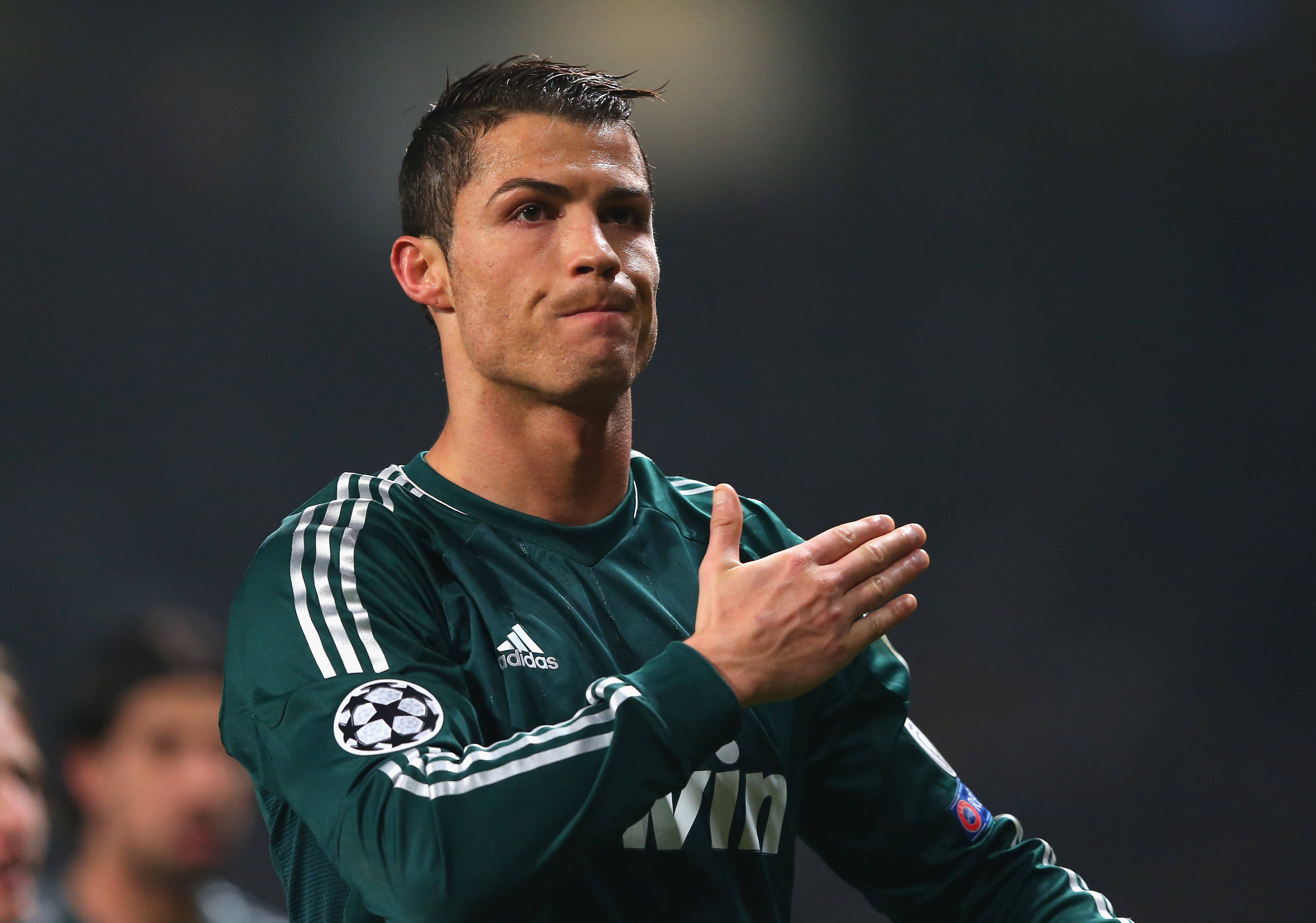 Cristiano Ronaldo, green Real Madrid jersey, stadium lights, 4K Desktop Wallpaper