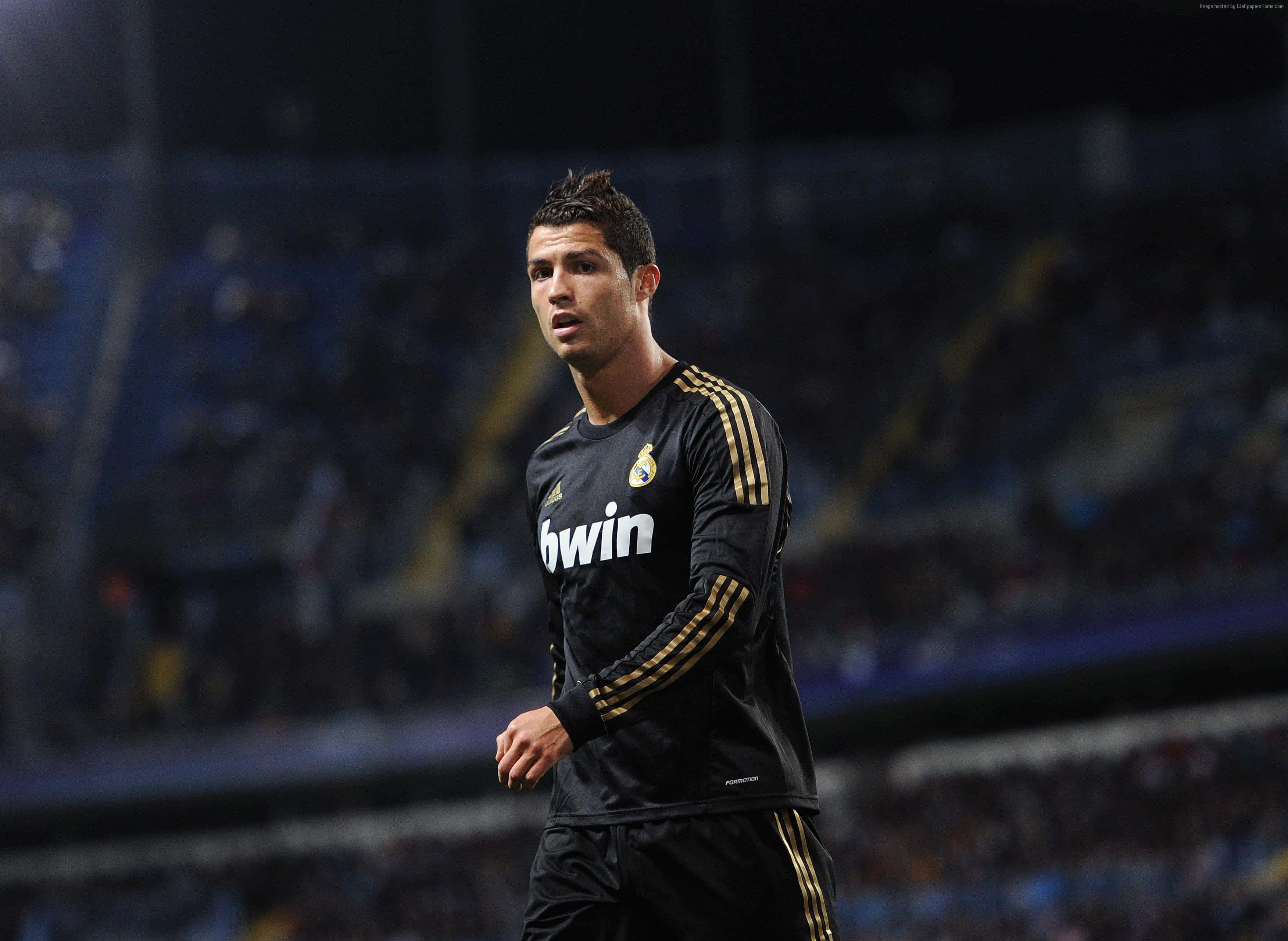 Cristiano Ronaldo, black Real Madrid kit, stadium lights, 2K Desktop Wallpaper
