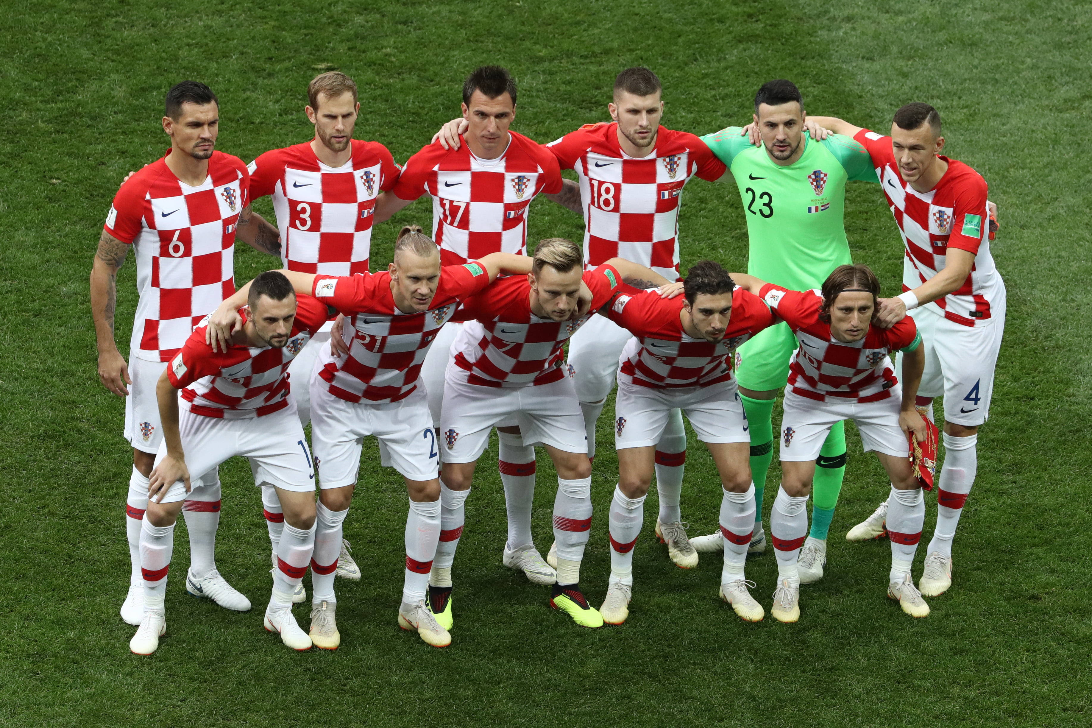 Croatia National Football Team, red and white checkered jerseys, vibrant green grass field, 2K Desktop Wallpaper