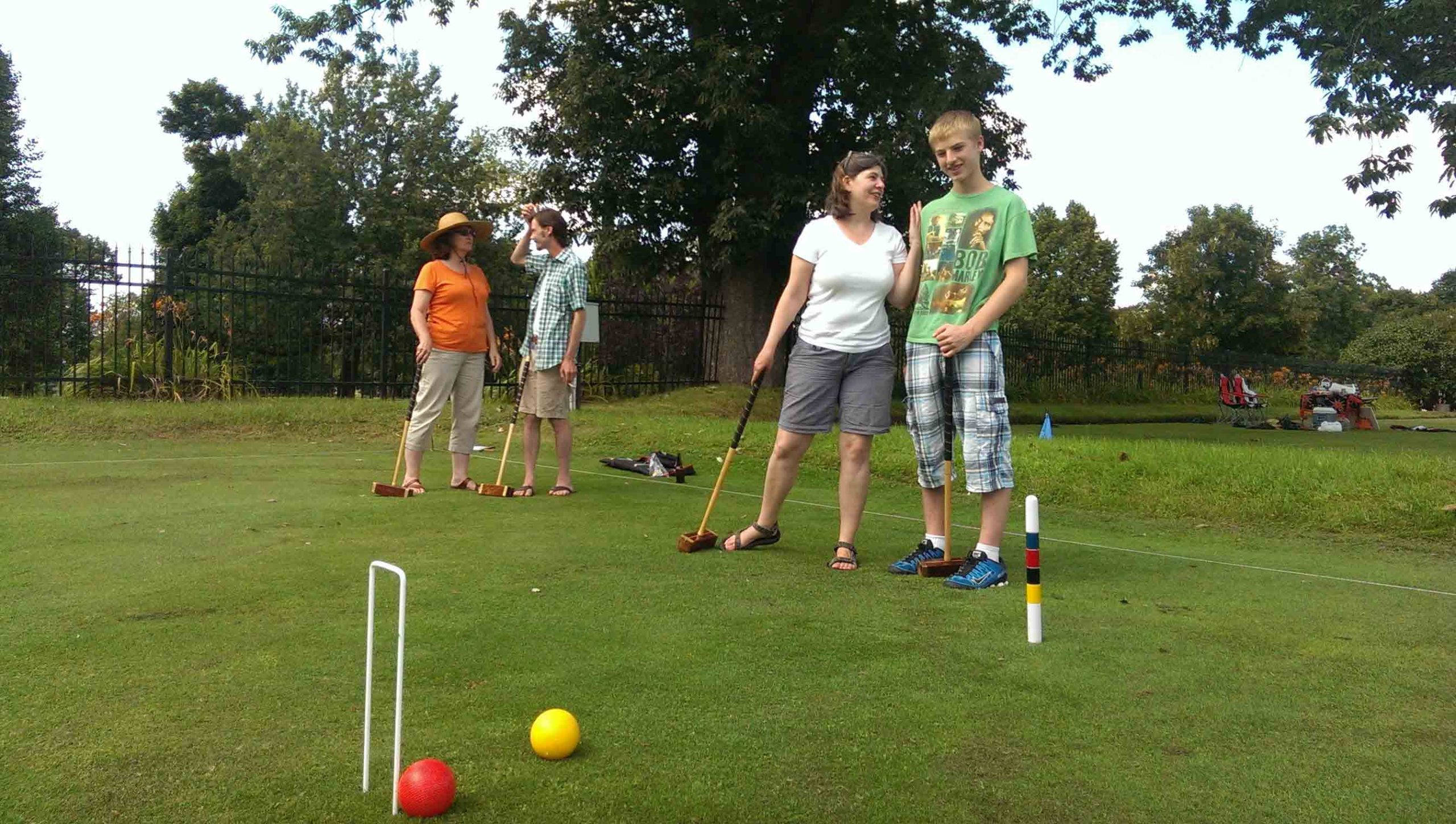 Croquet, lush green lawn, bright daylight, 2K Desktop Wallpaper