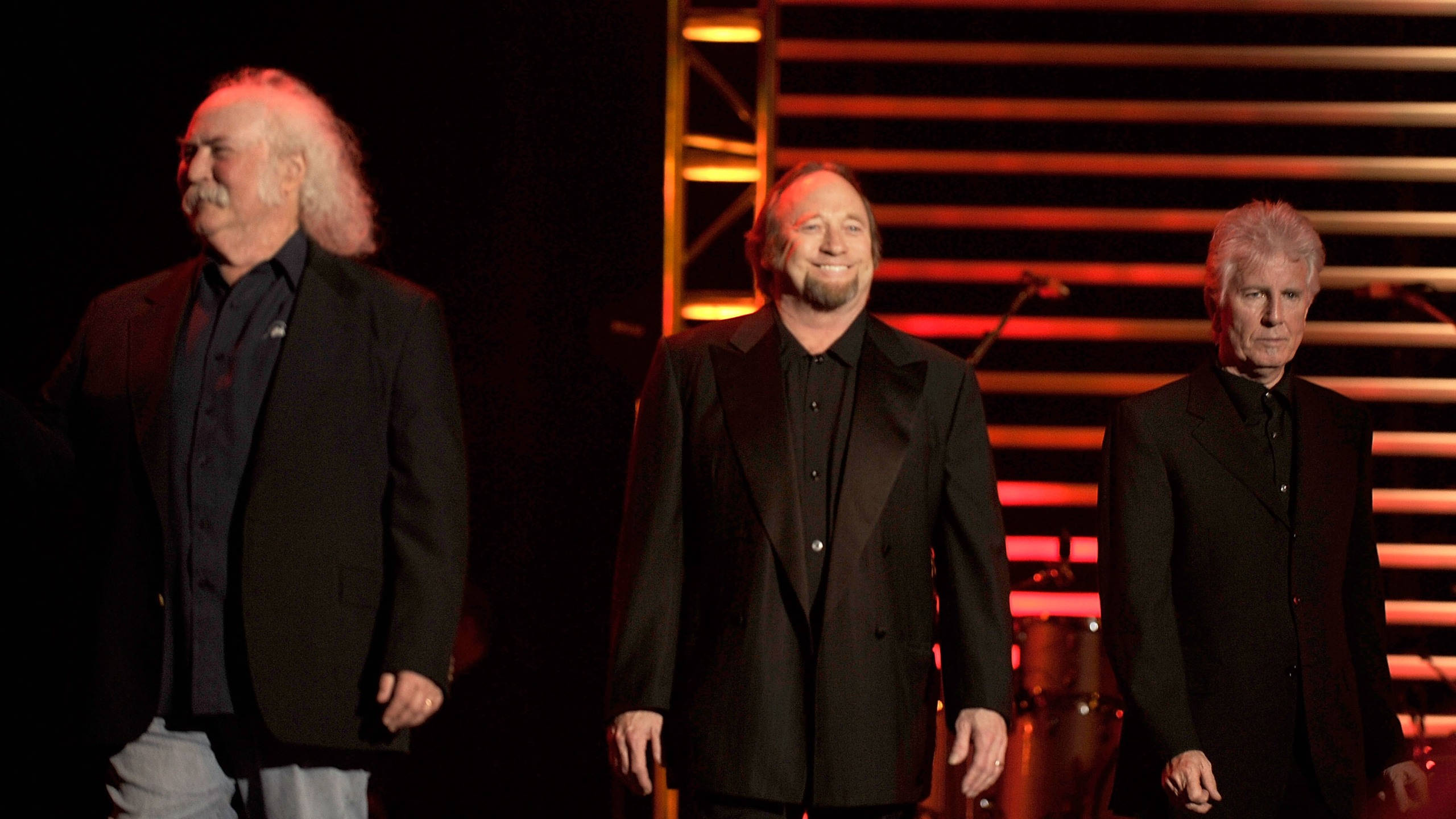 Crosby Stills And Nash, black suits, dimly lit stage, 2K Desktop Wallpaper