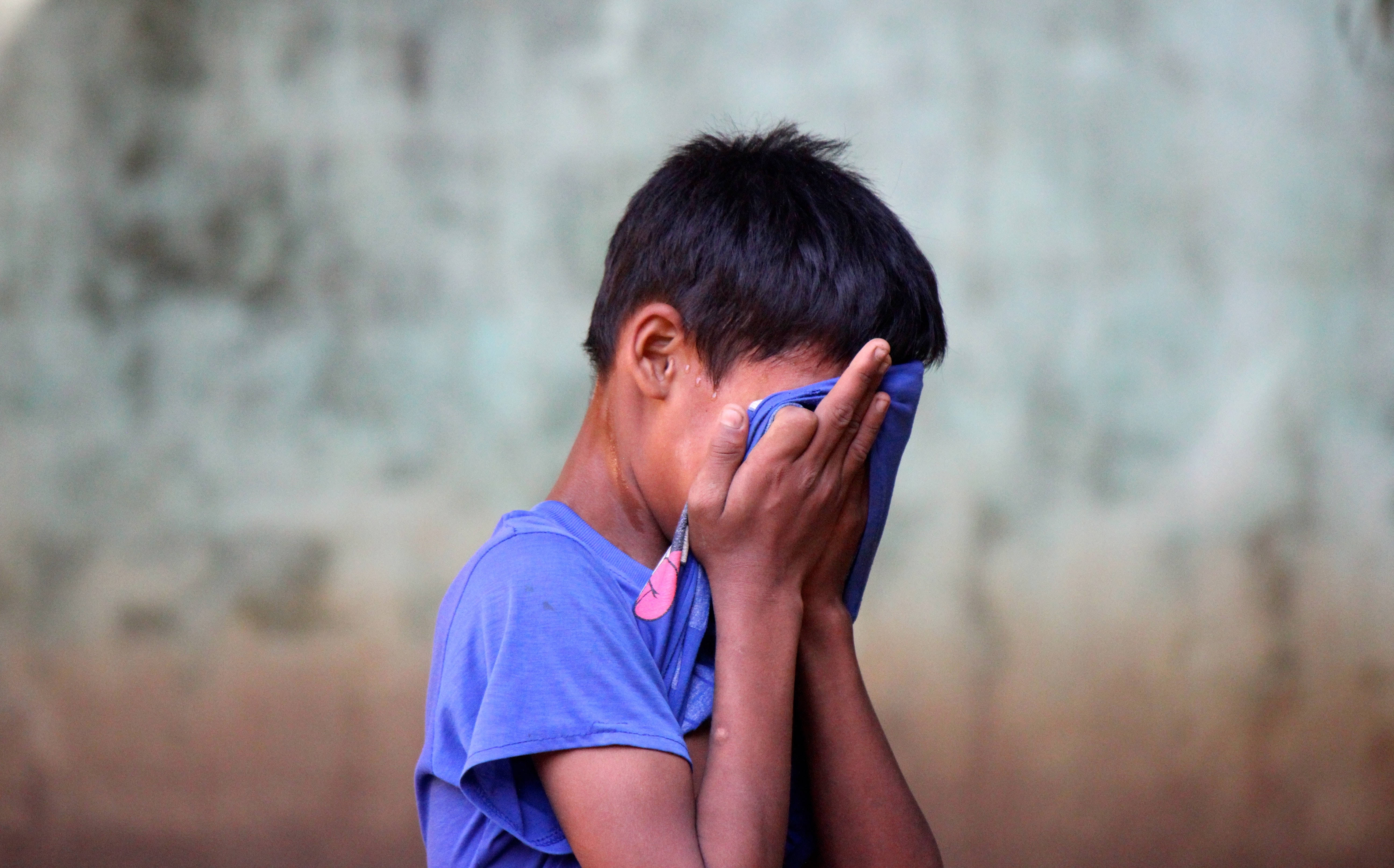 Crying Sad Boy, blue shirt, weathered wall, 5K Desktop Wallpaper