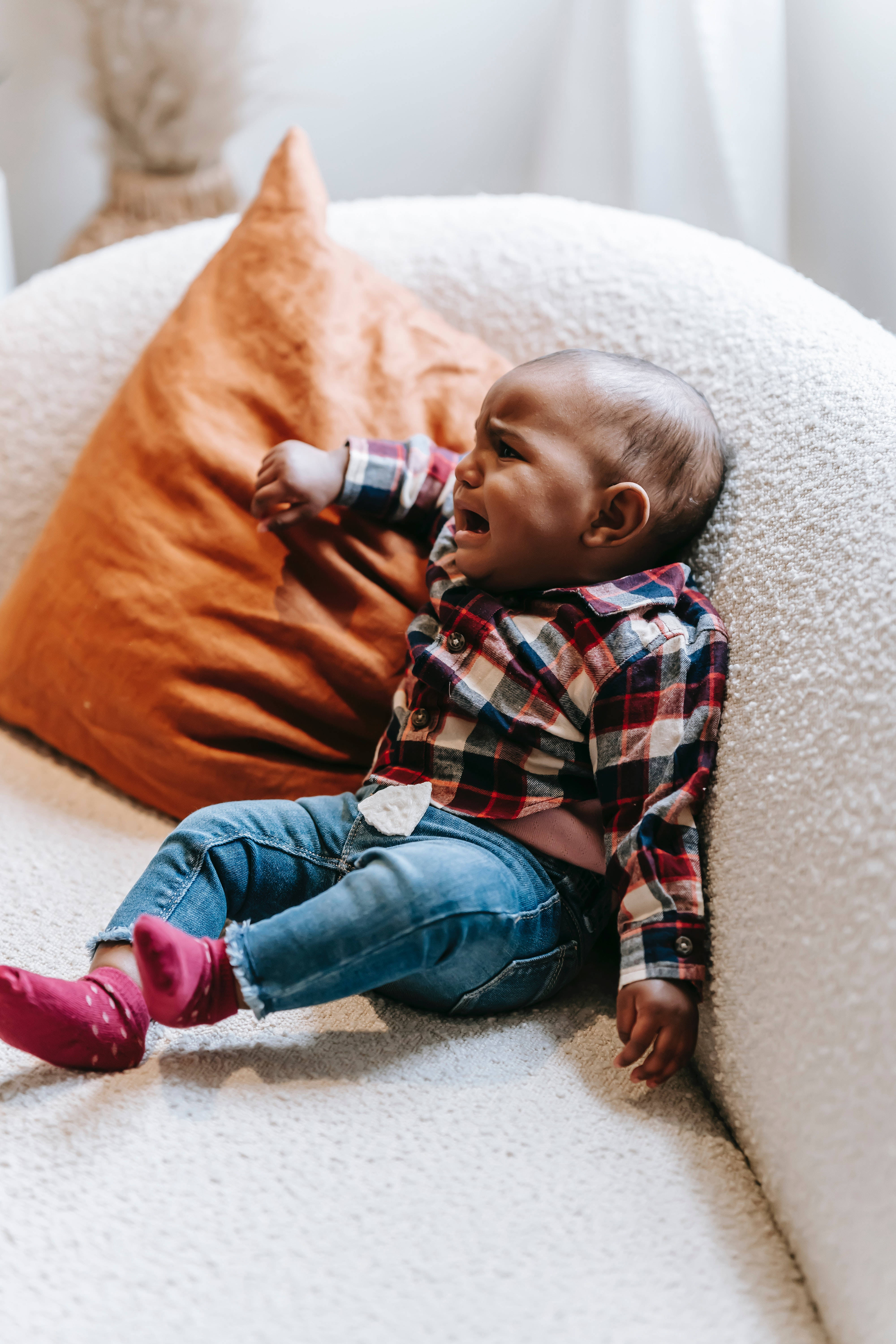 crying sad boy, plaid shirt, textured white couch, 5K Phone Wallpaper