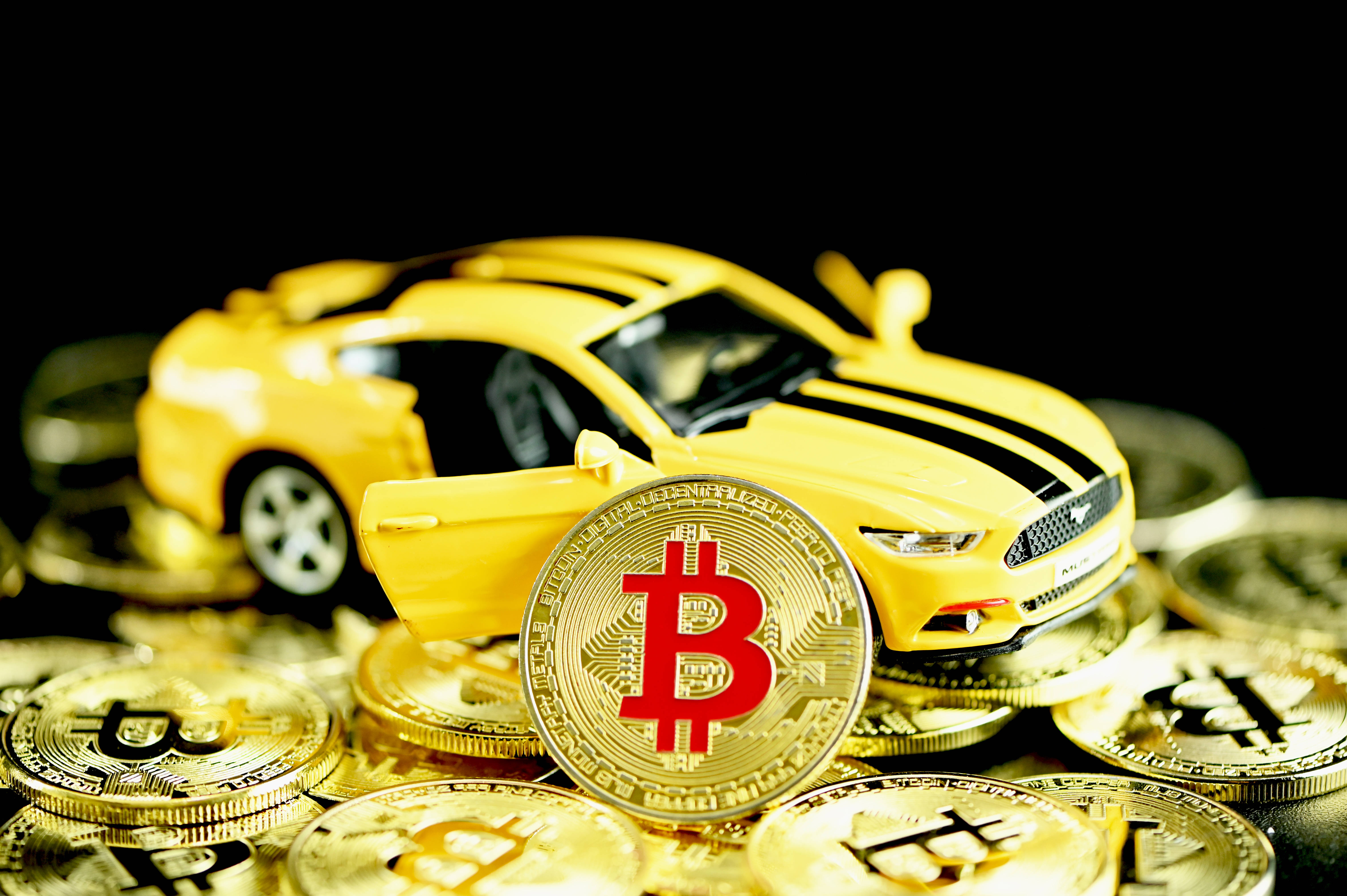 yellow toy sports car, golden Bitcoin coins, black background, 5K Desktop Wallpaper