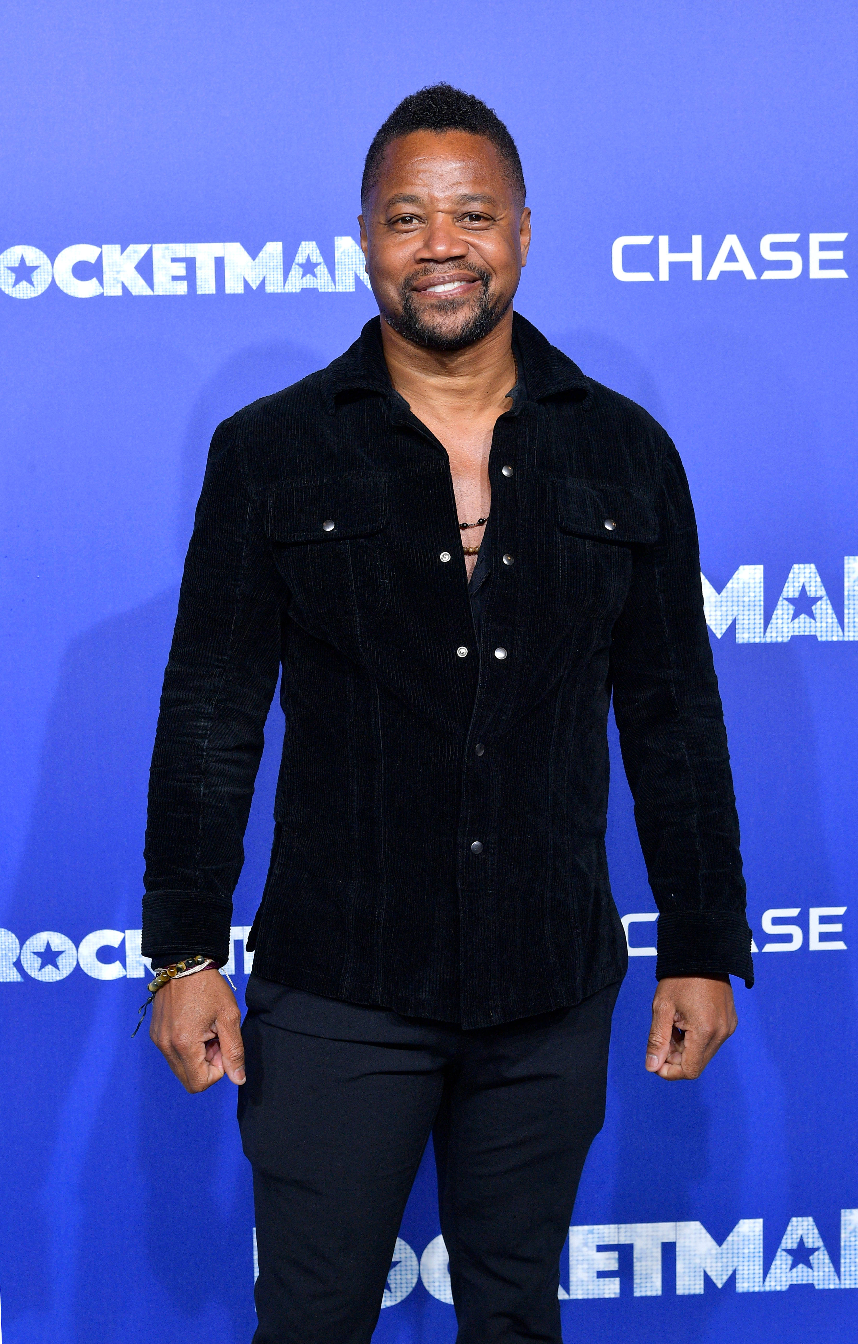 Cuba Gooding Jr, black corduroy shirt, blue 'Rocketman' event backdrop, 5K Phone Wallpaper