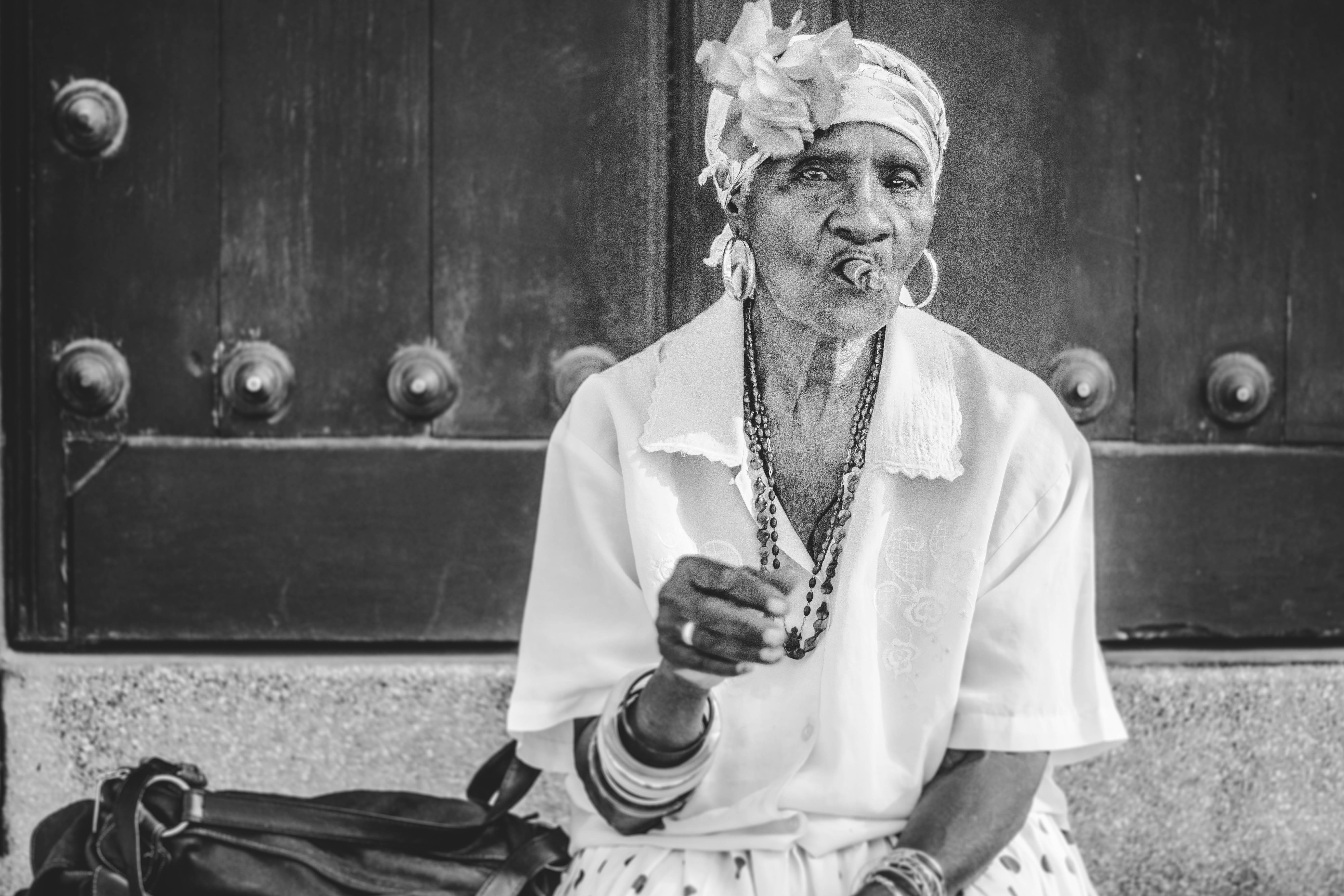 Cuban elderly woman, flower headwrap, hoop earrings, 5K Desktop Wallpaper