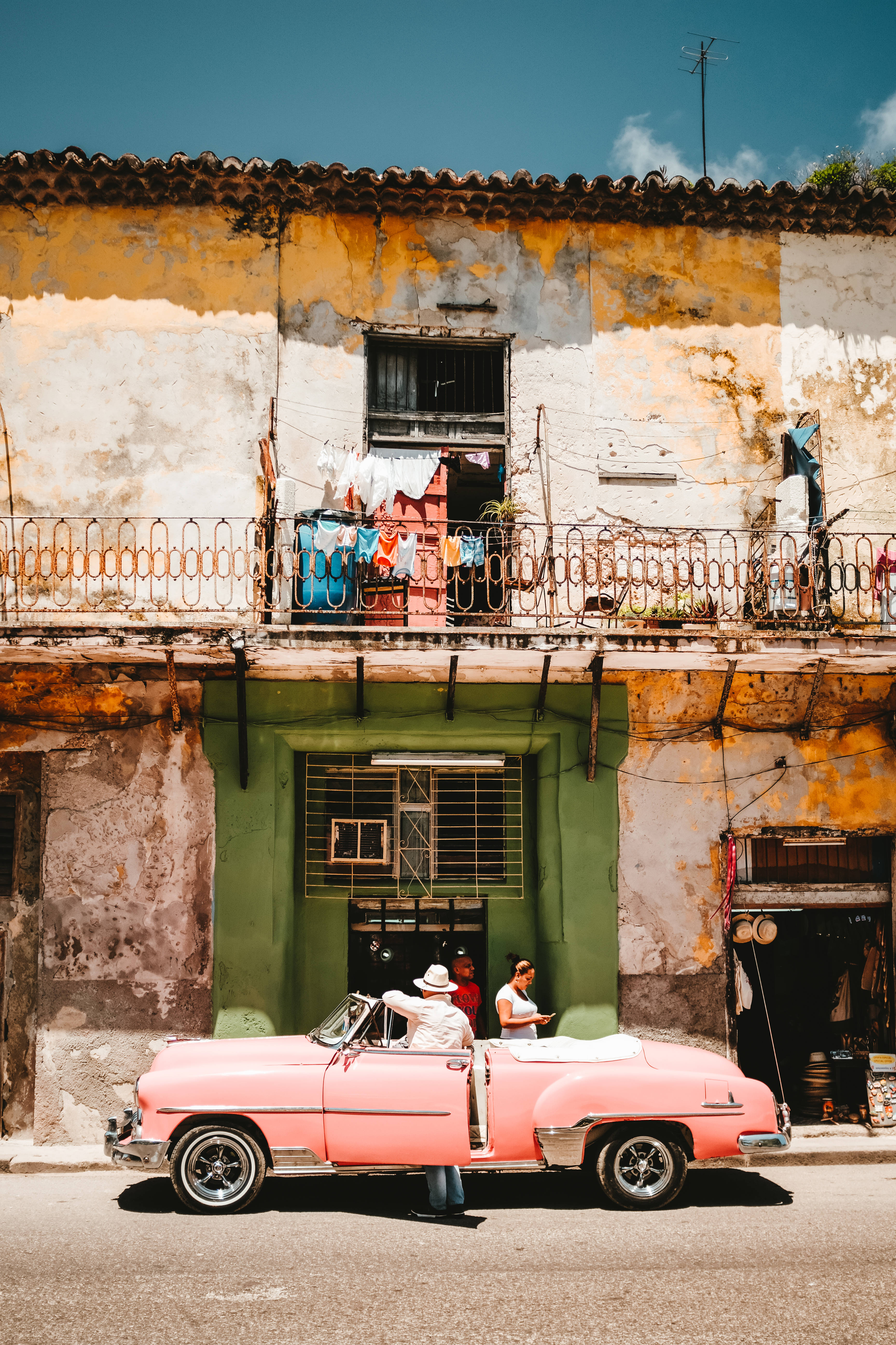 pink convertible, Cuban street, weathered colonial buildings, 5K Phone Wallpaper