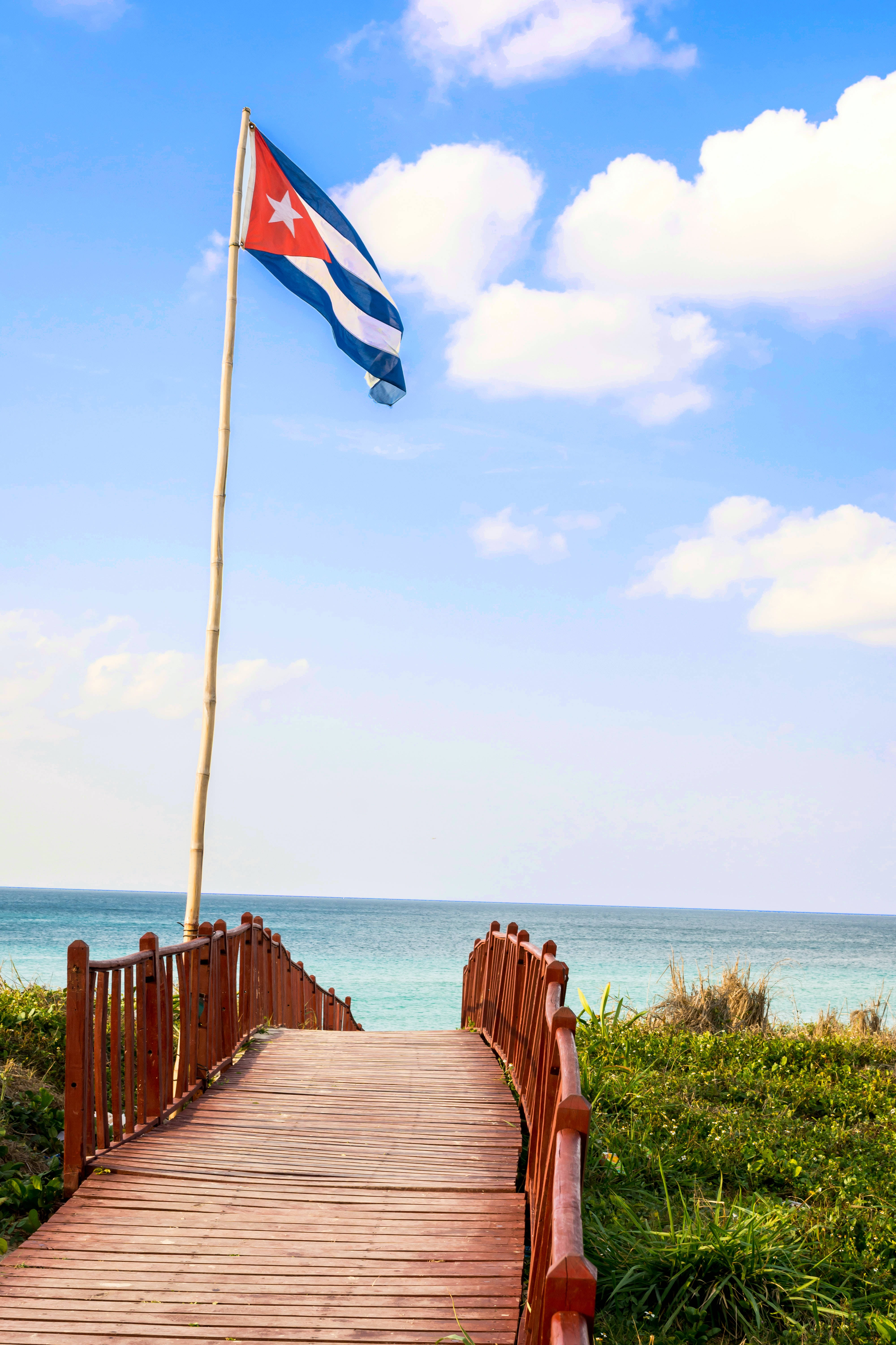 Cuban flag, wooden footbridge, bright blue sky, 5K Phone Wallpaper