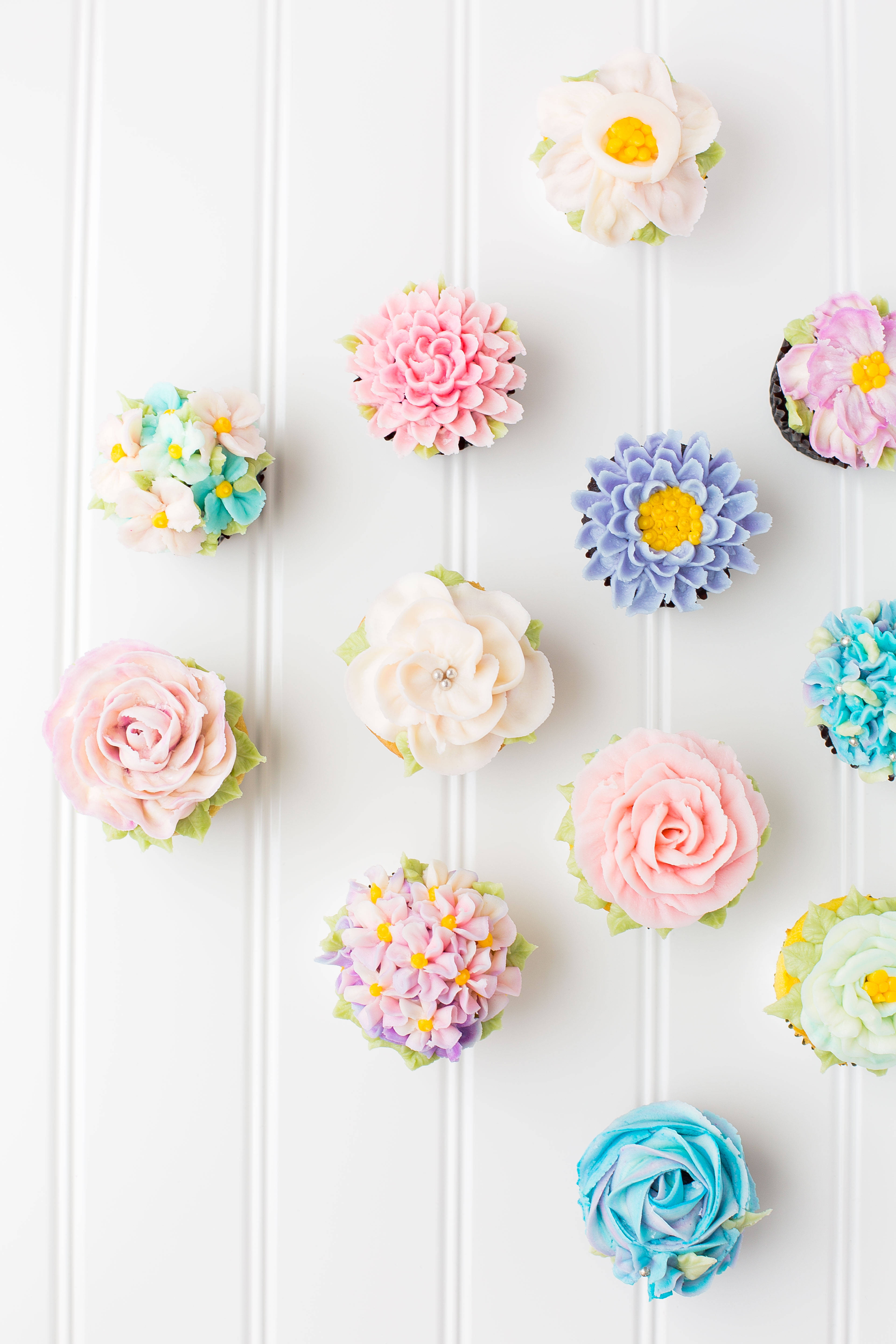Flower Icing Cupcakes, pastel-colored, intricate floral frosting, 5K Phone Wallpaper