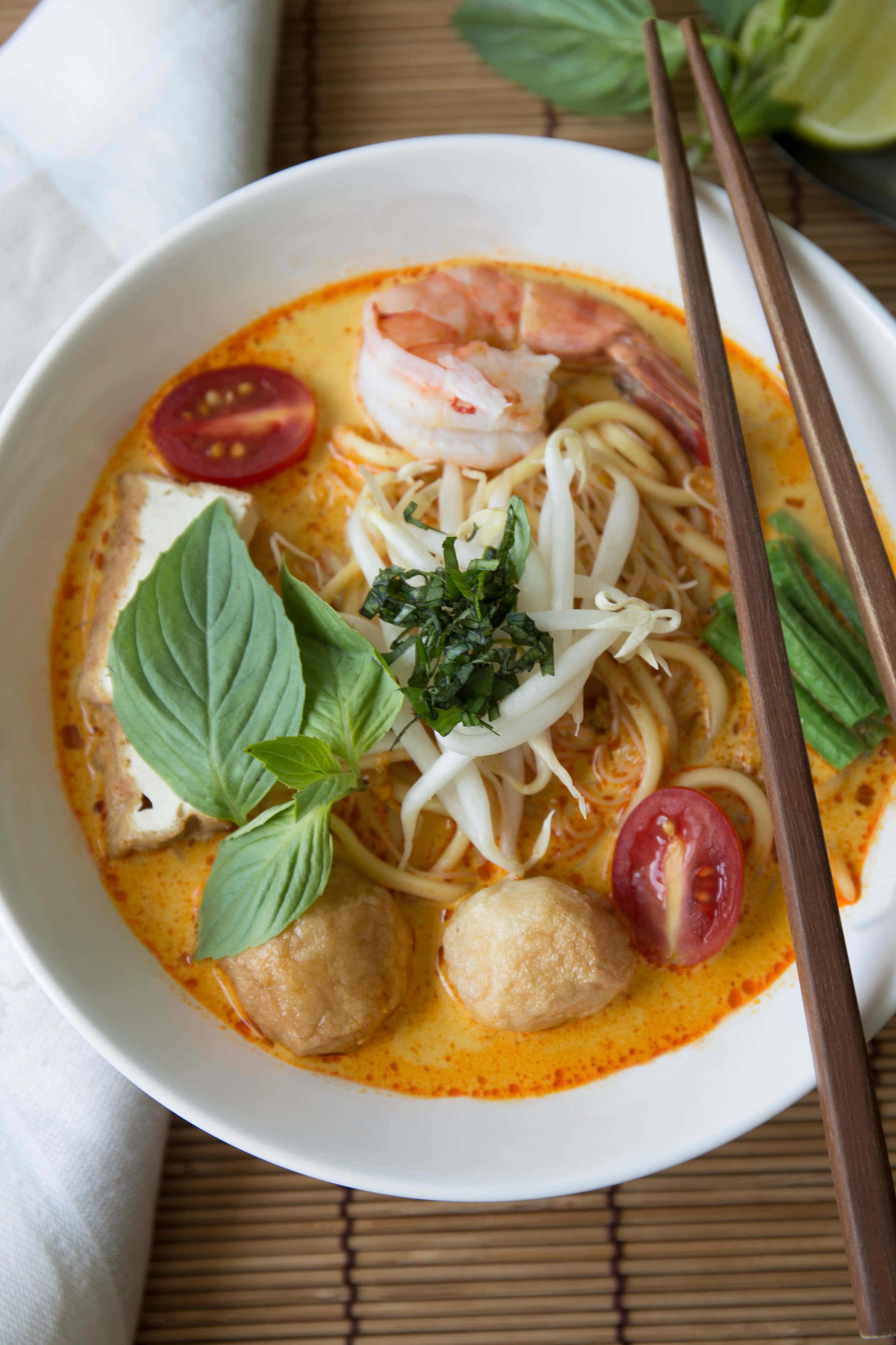 Creamy Coconut Curry Laksa Noodles, vibrant orange, steaming bowl, 2K Phone Wallpaper