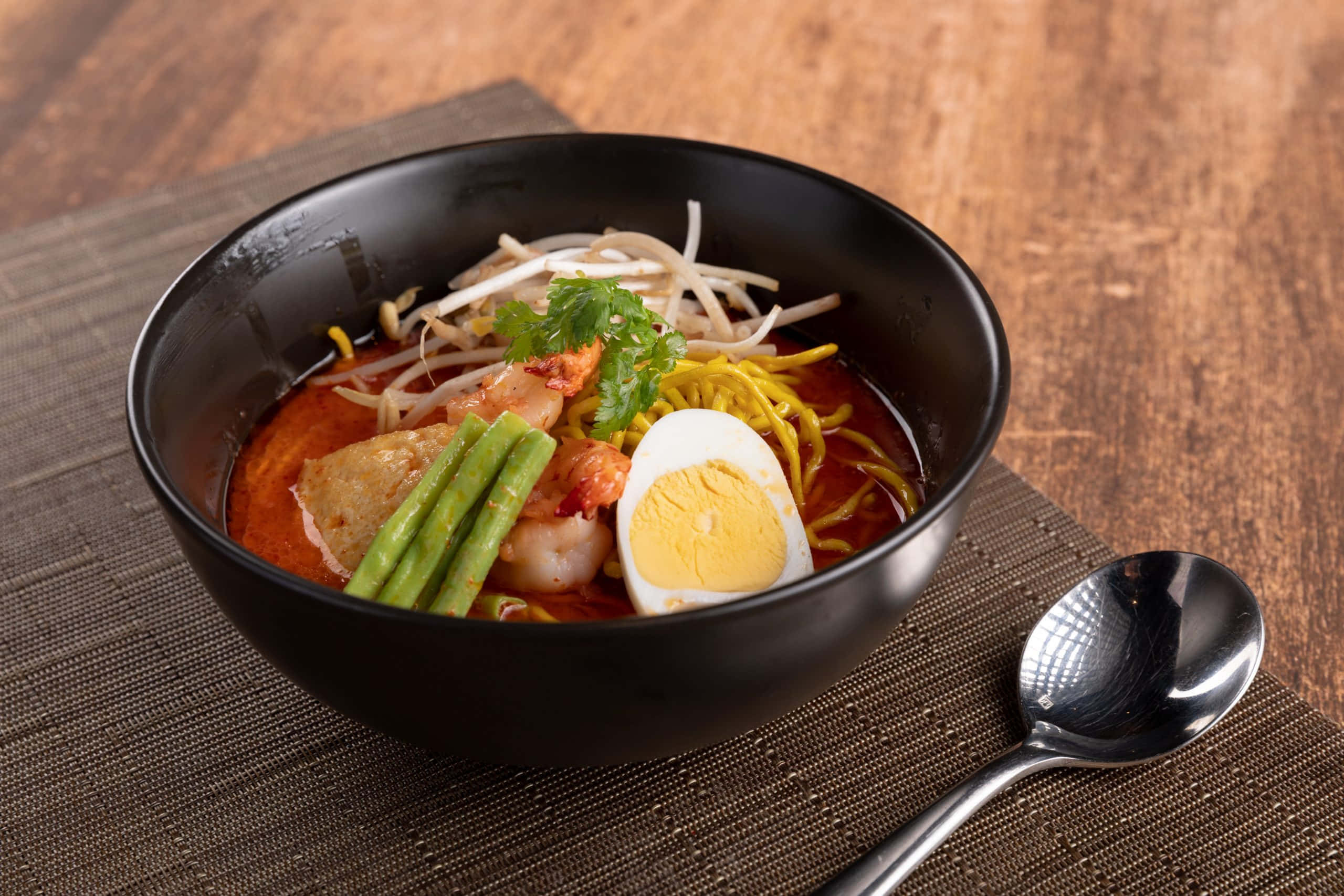 Curry Laksa, steaming bowl, vibrant red noodle soup, 2K Desktop Wallpaper